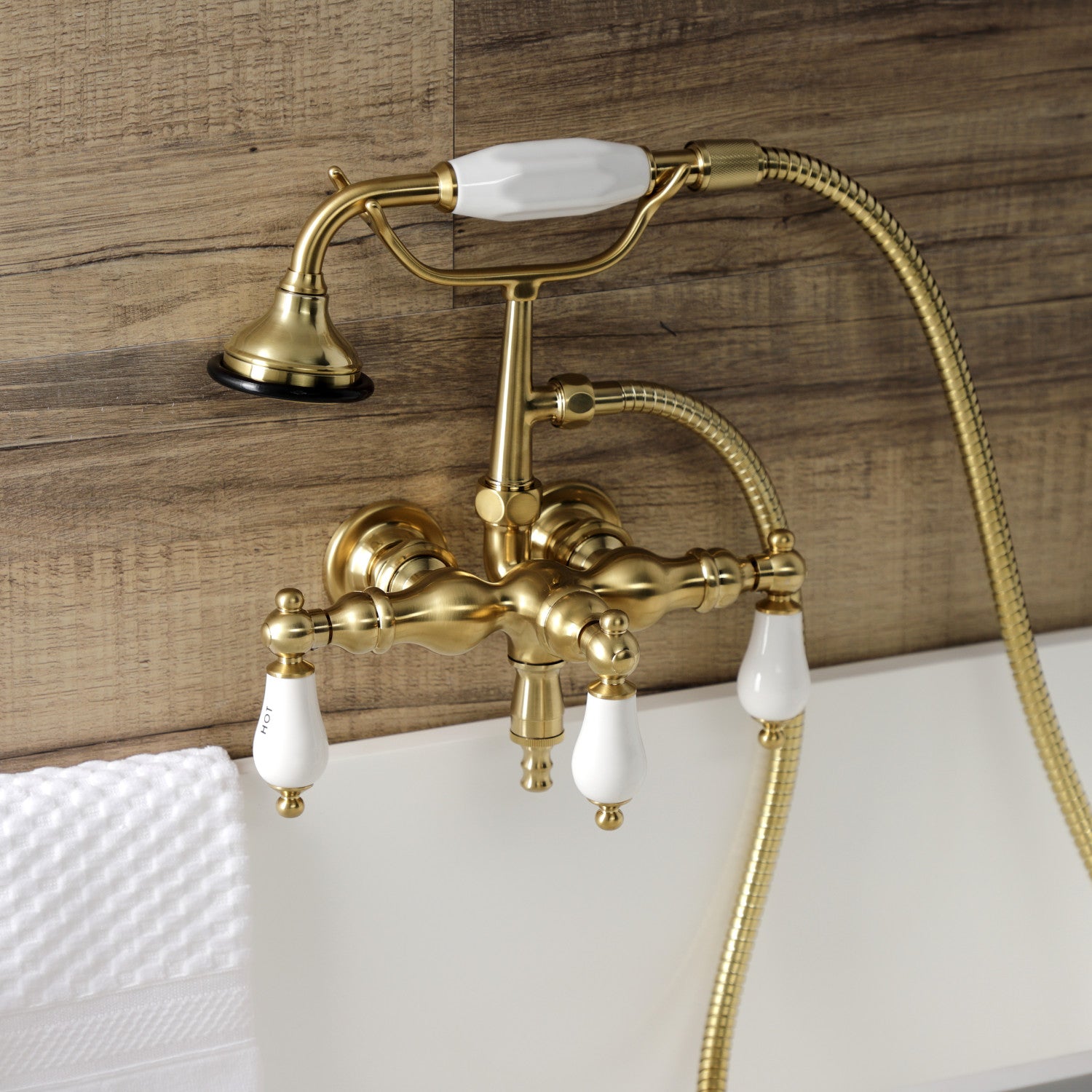 Vintage AE21T7 3-Handle Wall Mount Clawfoot Bathtub Faucet with Hand Shower in Brushed Brass - Perfect for Classic Bathroom Renovations & Luxury Spa Experience