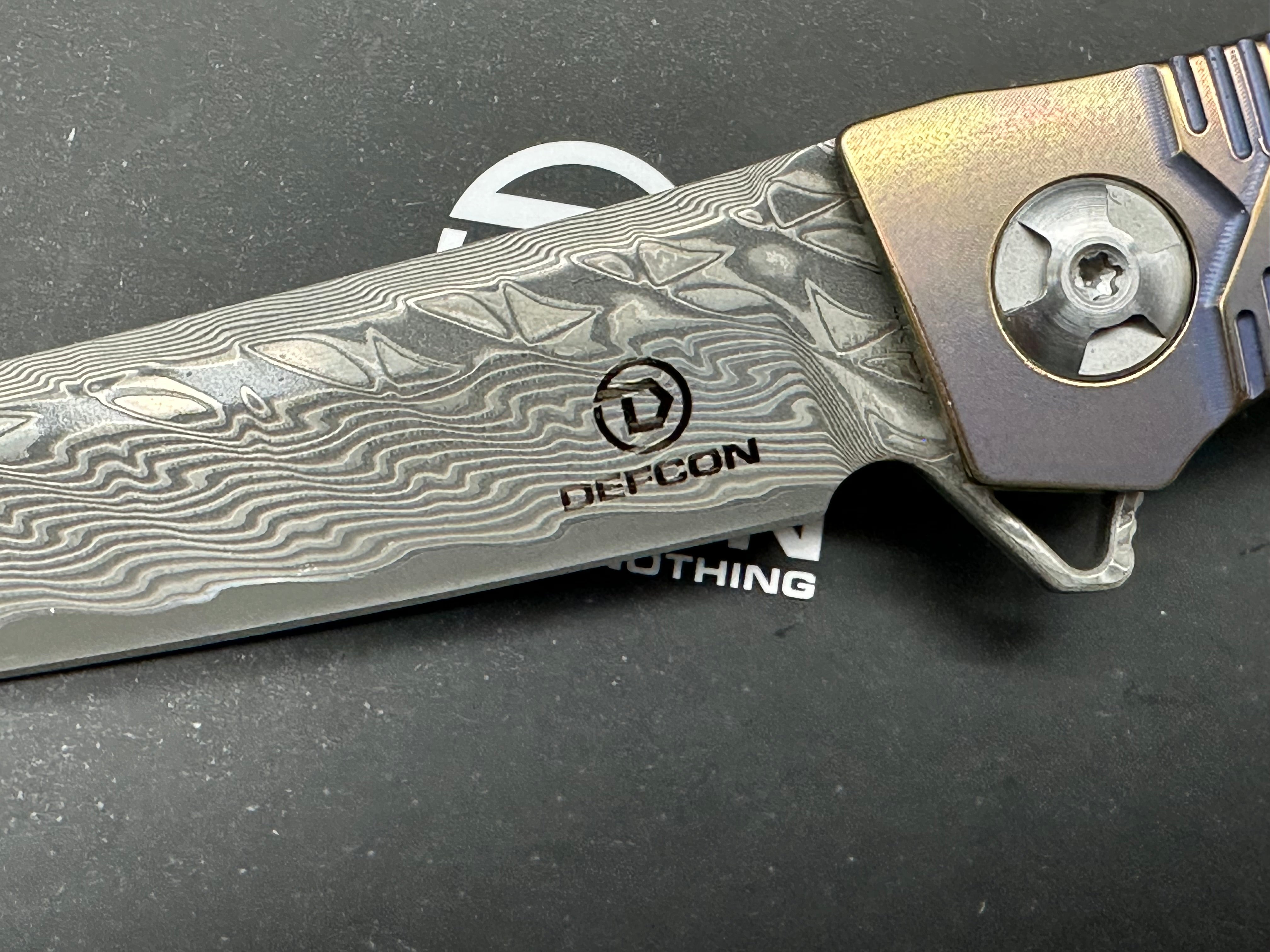 DEFCON JK Series Folding Knife - Damascus Steel Blade with Bronze Titanium Handle - EDC Pocket Knife for Camping, Hiking & Outdoor Survival