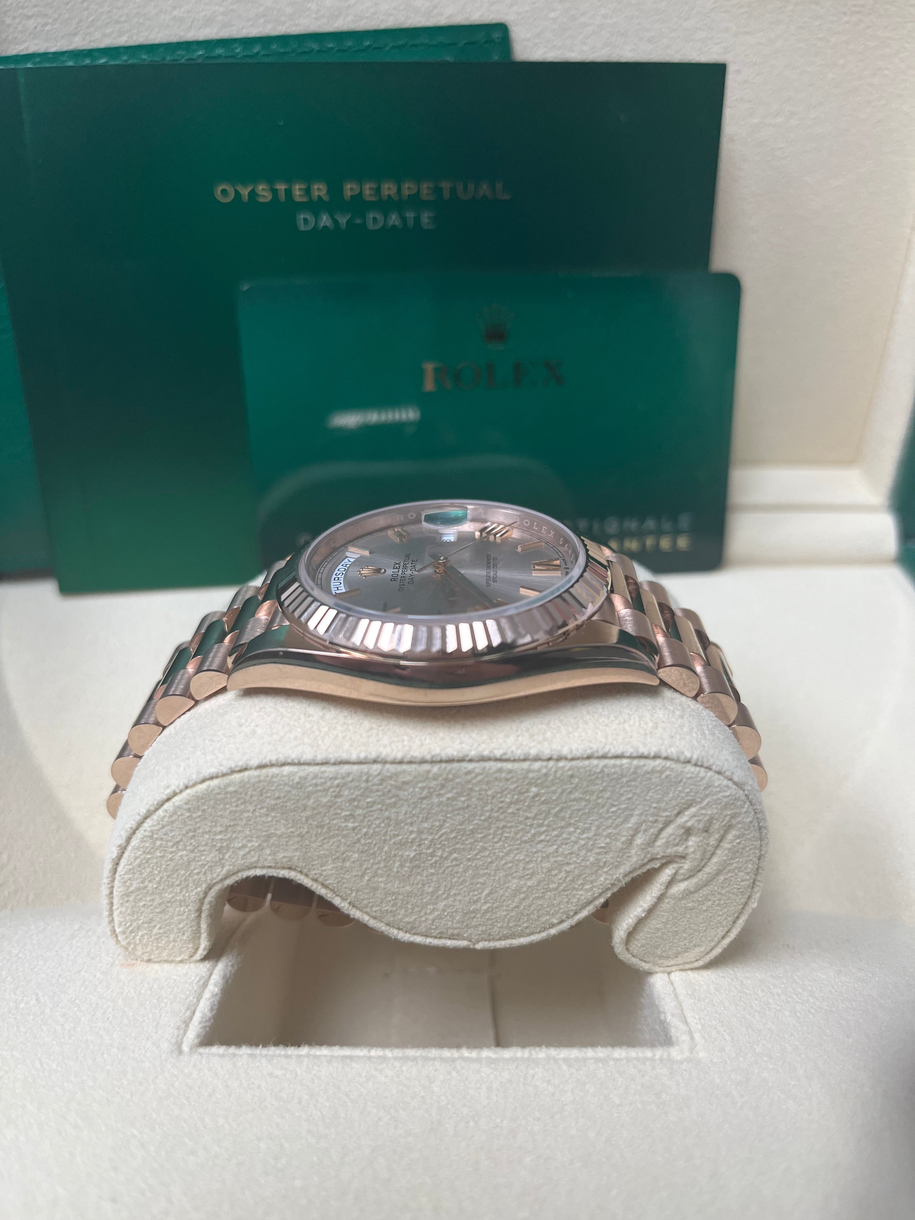 Rolex Day Date 40mm Rose Gold Watch with Sundust Roman Dial & Fluted Bezel (Ref #228235) - Luxury Dress Watch for Business & Formal Occasions