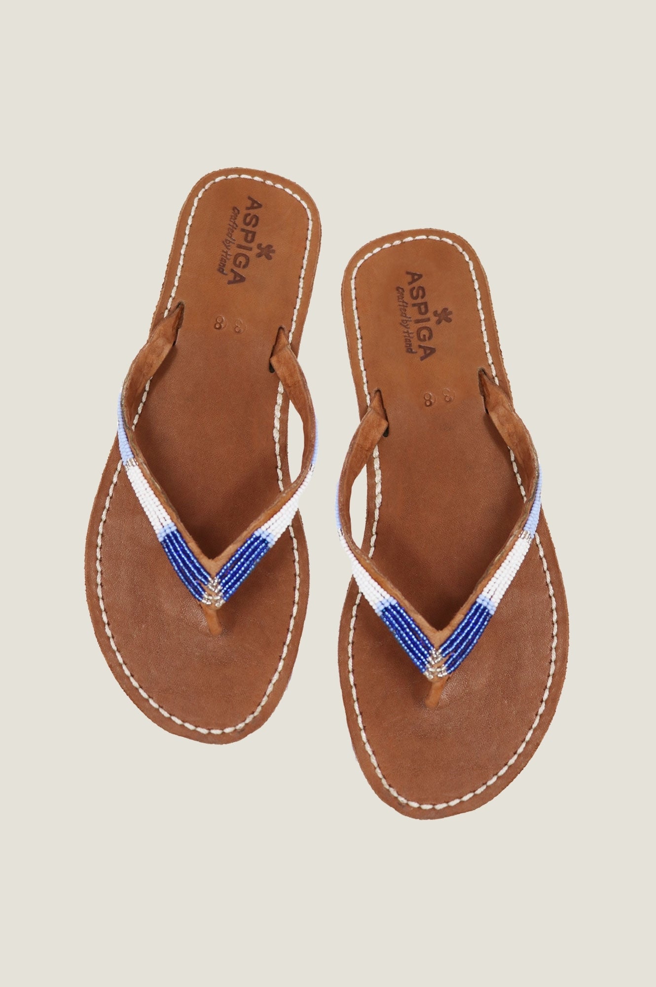 Naisha Soft Padded Sole Leather Sandals for Women - Comfortable Blue Metallic Flip Flops | Perfect for Beach, Pool, and Summer Vacation Outfits