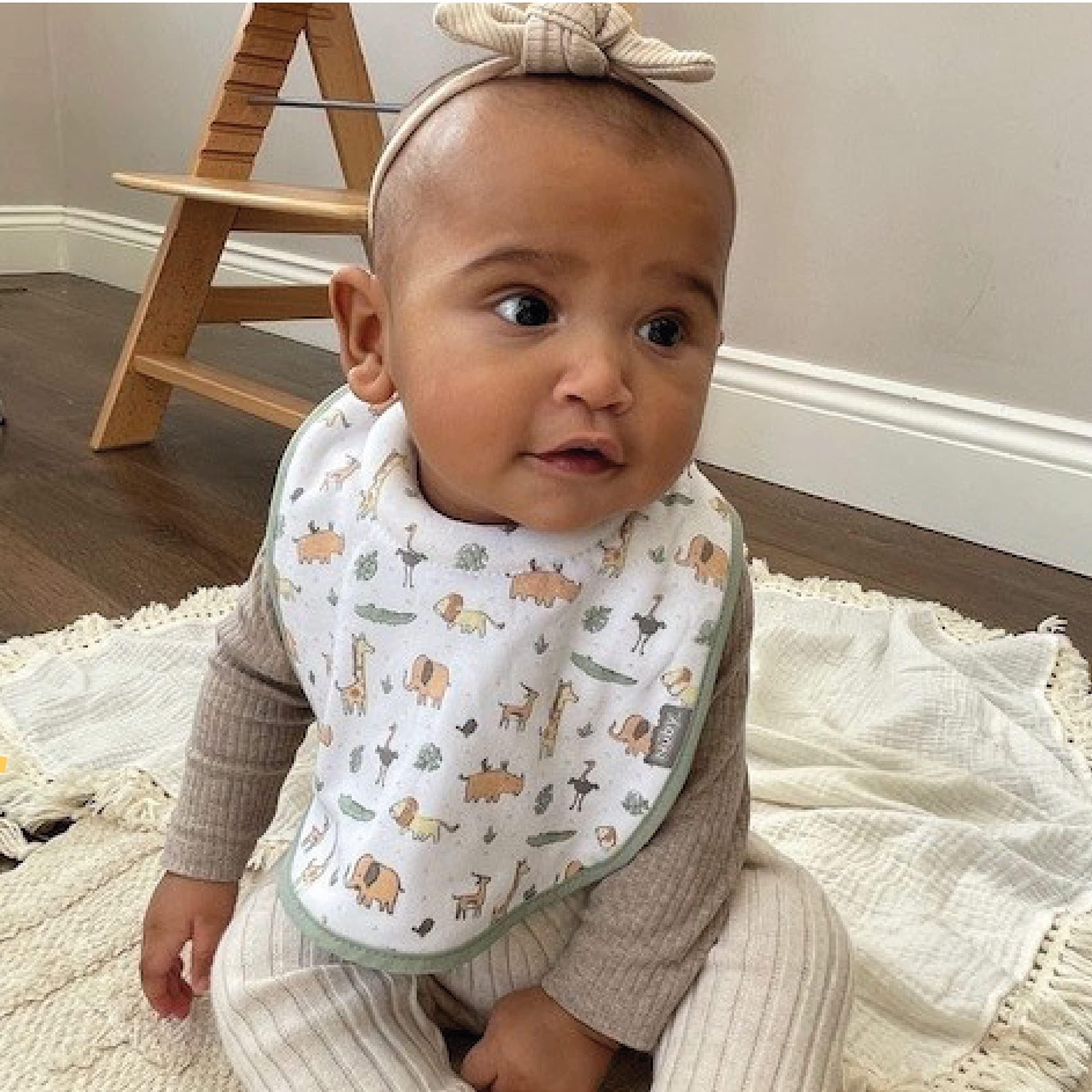 Nuby Snug and Dry Bibs - Organic Cotton Baby Bibs with Padded Neckline, Machine Washable, One Size (Pack of 4) - Perfect for Feeding, Drooling & Messy Mealtime Protection