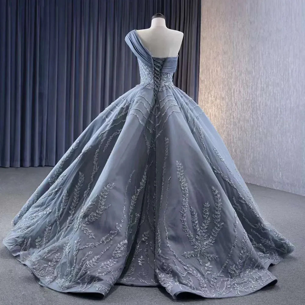 Serene Hill Gray One Shoulder Lace Up Beaded Luxury Ball Gown Wedding Dress 2025 | Custom Made Bridal Gown HM231074 | Perfect for Formal Weddings, Red Carpet Events & Evening Galas