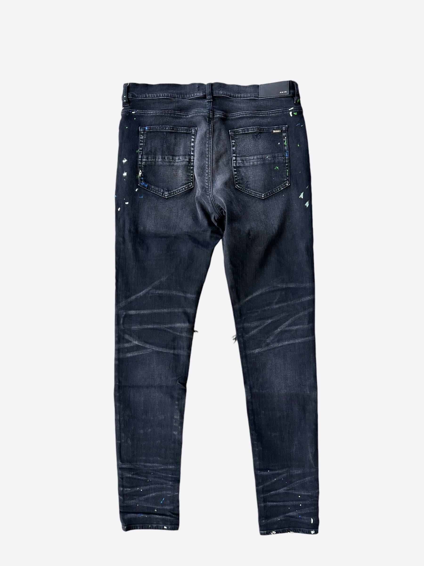 Amiri Aged Black Paint Splatter MX1 Jeans for Men | Distressed Designer Denim | Perfect for Streetwear & Night Out Fashion