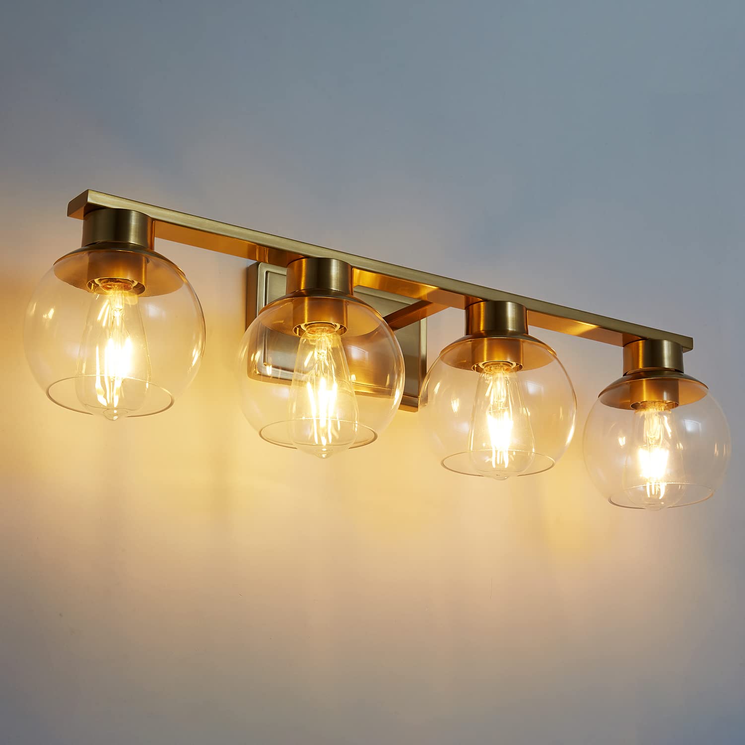 PAZALA Brushed Brass Bathroom Light Fixture - 4-Light Vanity Wall Sconce with Globe Glass Shade, E26 Base - Modern Over Mirror Lighting for Bathroom, Bedroom & Hallway - Dimmable Vanity Lights for Makeup, Shaving & Ambient Lighting