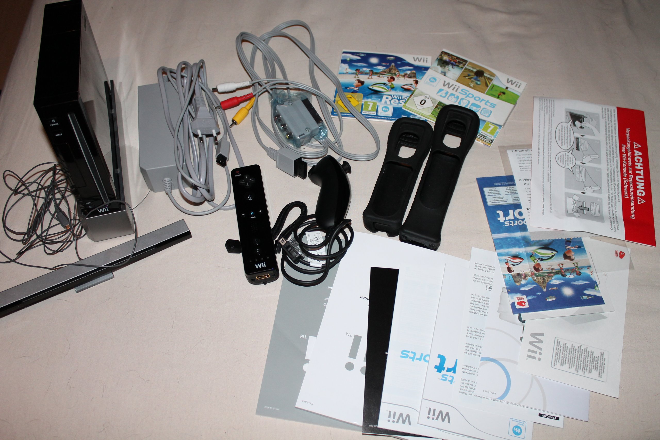 Original Wii Console Black Bundle with Wii Sports & Wii Sports Resort - Includes Black Wii Remote Plus - Perfect for Family Game Nights & Retro Gaming Fun