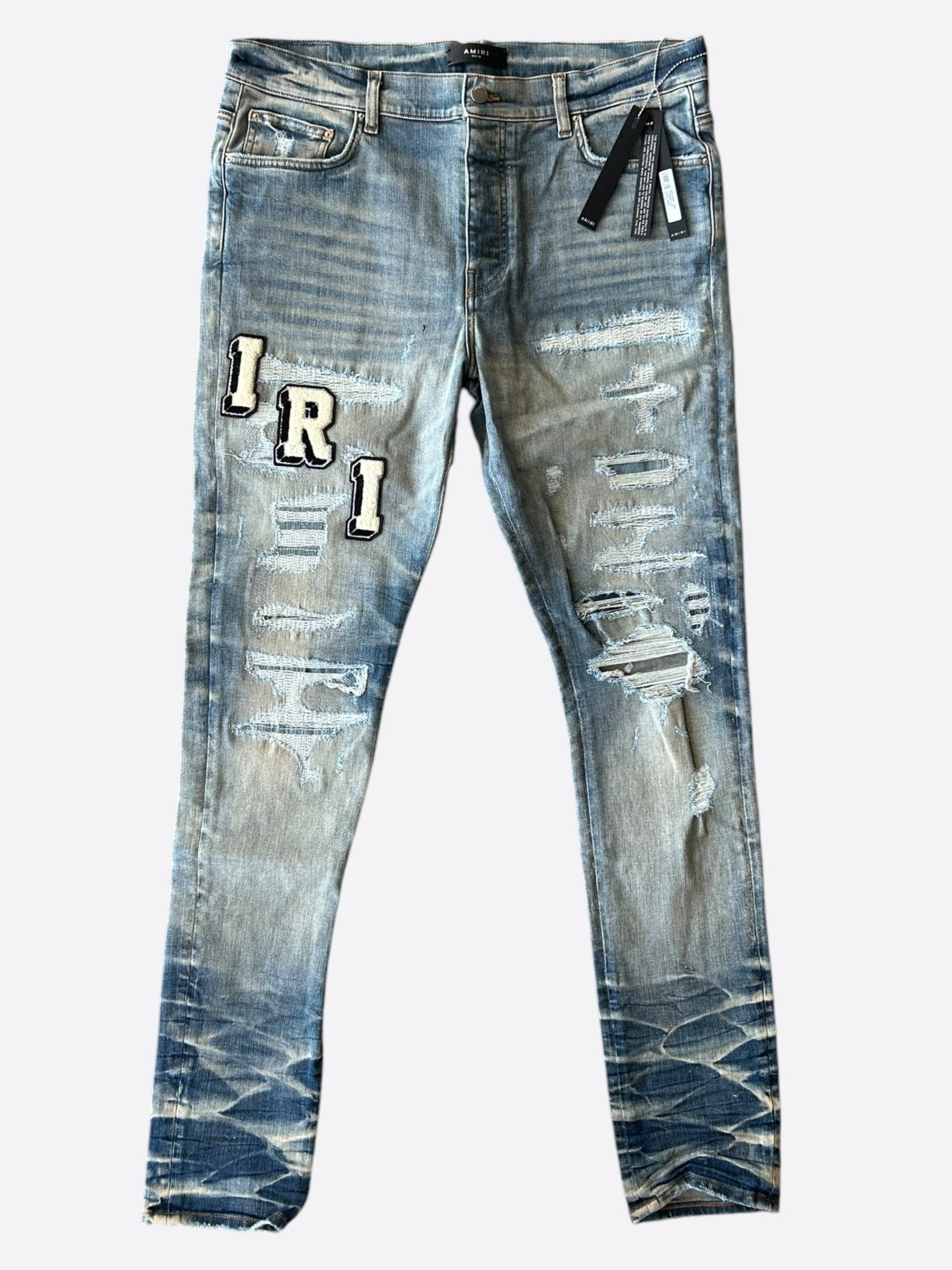 Amiri Vintage Indigo Varsity Applique Logo Jeans for Men - Distressed Denim Pants with Embroidered Patch - Perfect for Casual Wear & Street Style Outfits