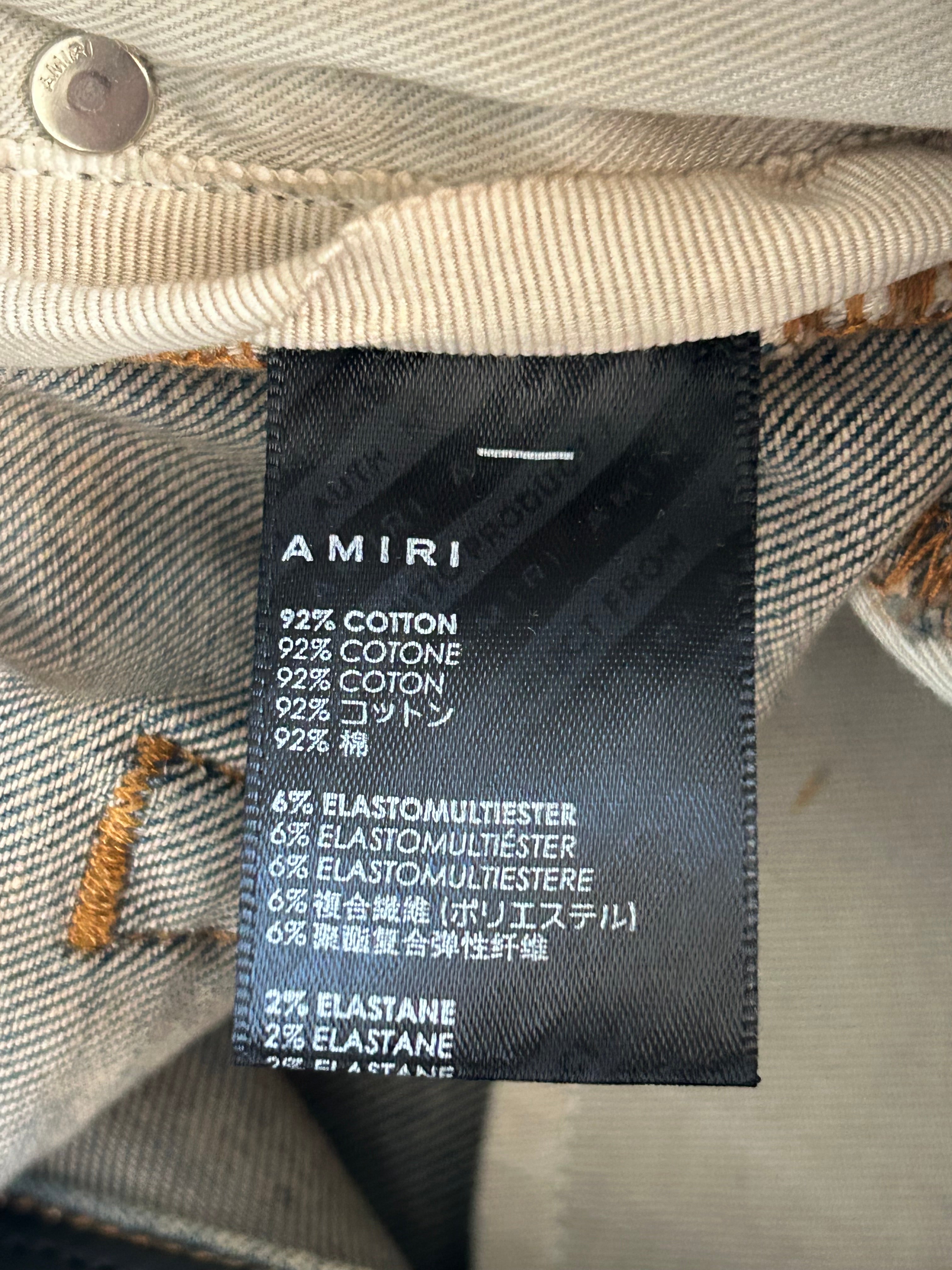 Amiri Vintage Indigo Varsity Applique Logo Jeans for Men - Distressed Denim Pants with Embroidered Patch - Perfect for Casual Wear & Street Style Outfits