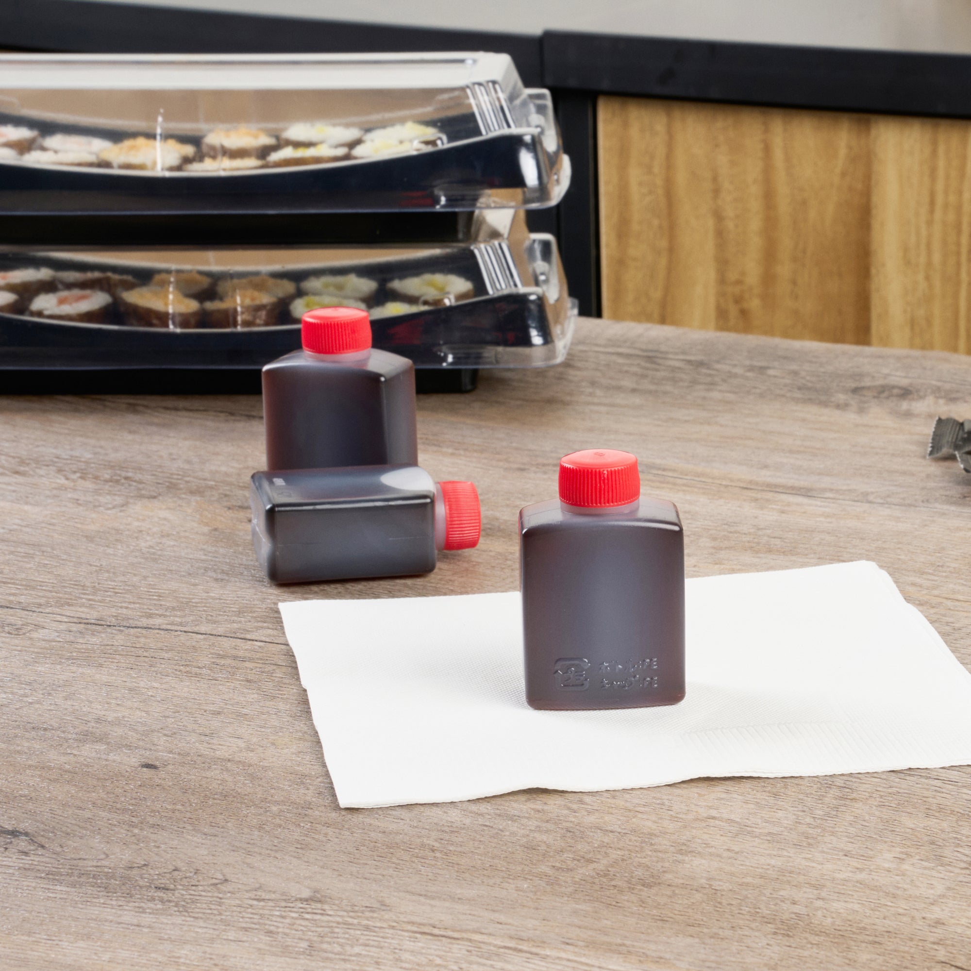 Bento Tek 2 oz Clear Plastic Soy Sauce Bottles with Red Caps (1.5