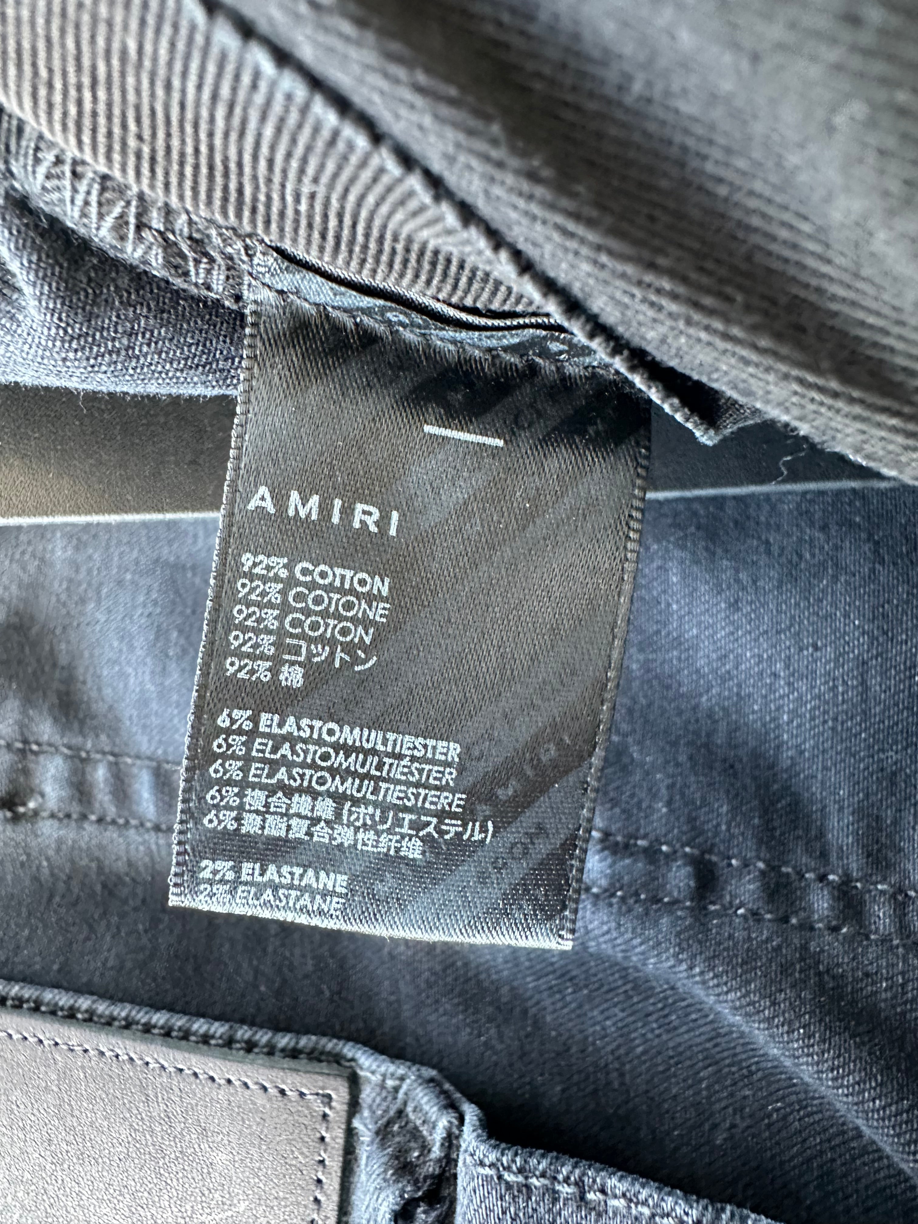 Amiri Aged Black Paint Splatter MX1 Jeans for Men | Distressed Designer Denim | Perfect for Streetwear & Night Out Fashion