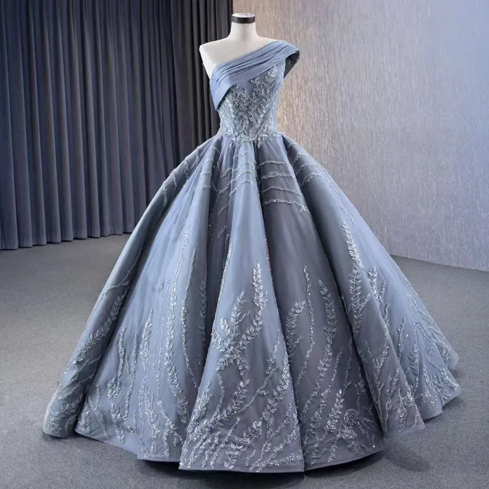Serene Hill Gray One Shoulder Lace Up Beaded Luxury Ball Gown Wedding Dress 2025 | Custom Made Bridal Gown HM231074 | Perfect for Formal Weddings, Red Carpet Events & Evening Galas