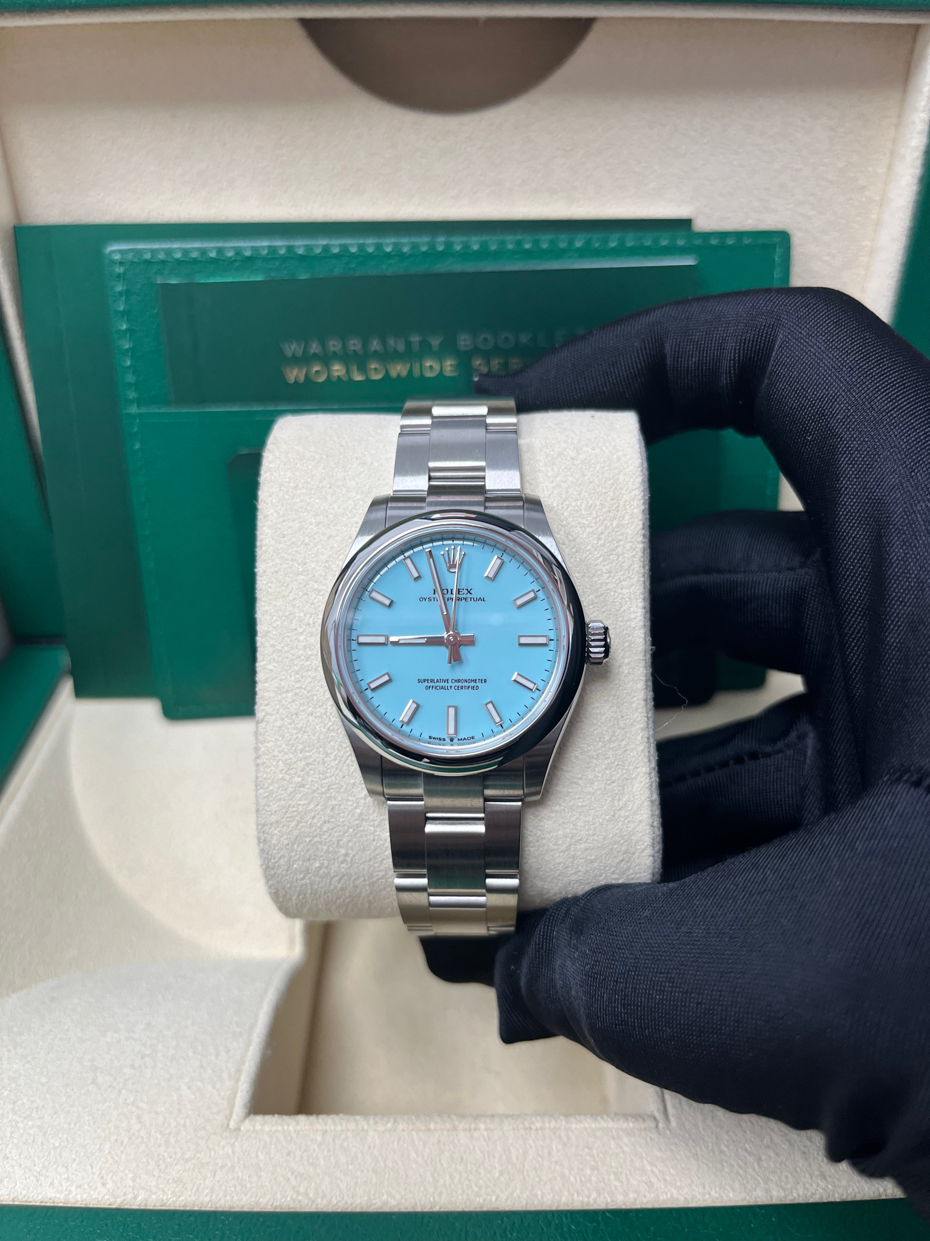 Rolex Oyster Perpetual 31mm Watch - Domed Bezel, Turquoise Blue Index Dial, Oyster Bracelet (Model 277200) | Luxury Women's Watch for Business, Parties & Special Occasions