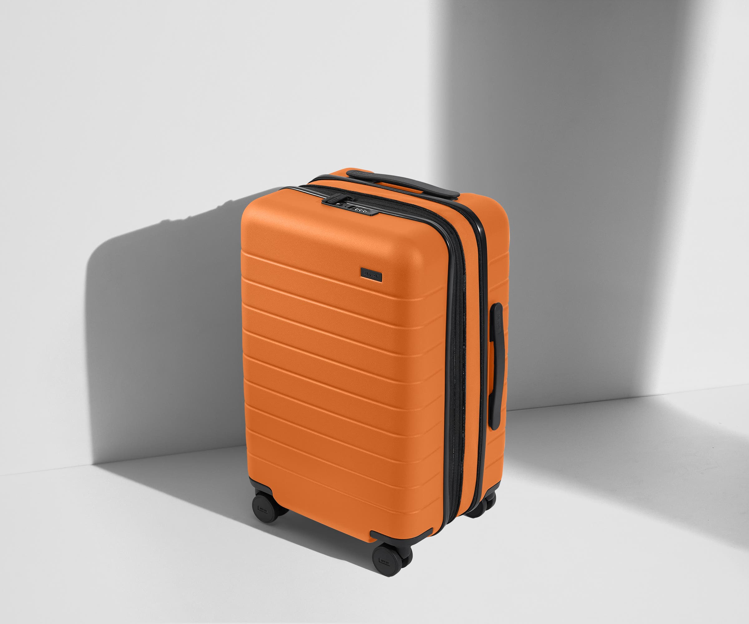The Carry On Flex in Sorbet Orange - Lightweight Expandable Suitcase for Travel, Business & Weekend Getaways | Perfect for Airplane Cabin & Road Trips