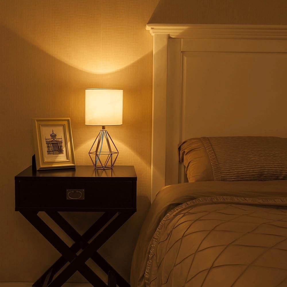 Modern Gold Hollow Out Base Bedside Table Lamp with Geometric Metal Base & White Fabric Shade - Elegant Nightstand Lamp for Bedroom, Kids Room & Living Room - Perfect for Reading, Decor & Ambient Lighting
