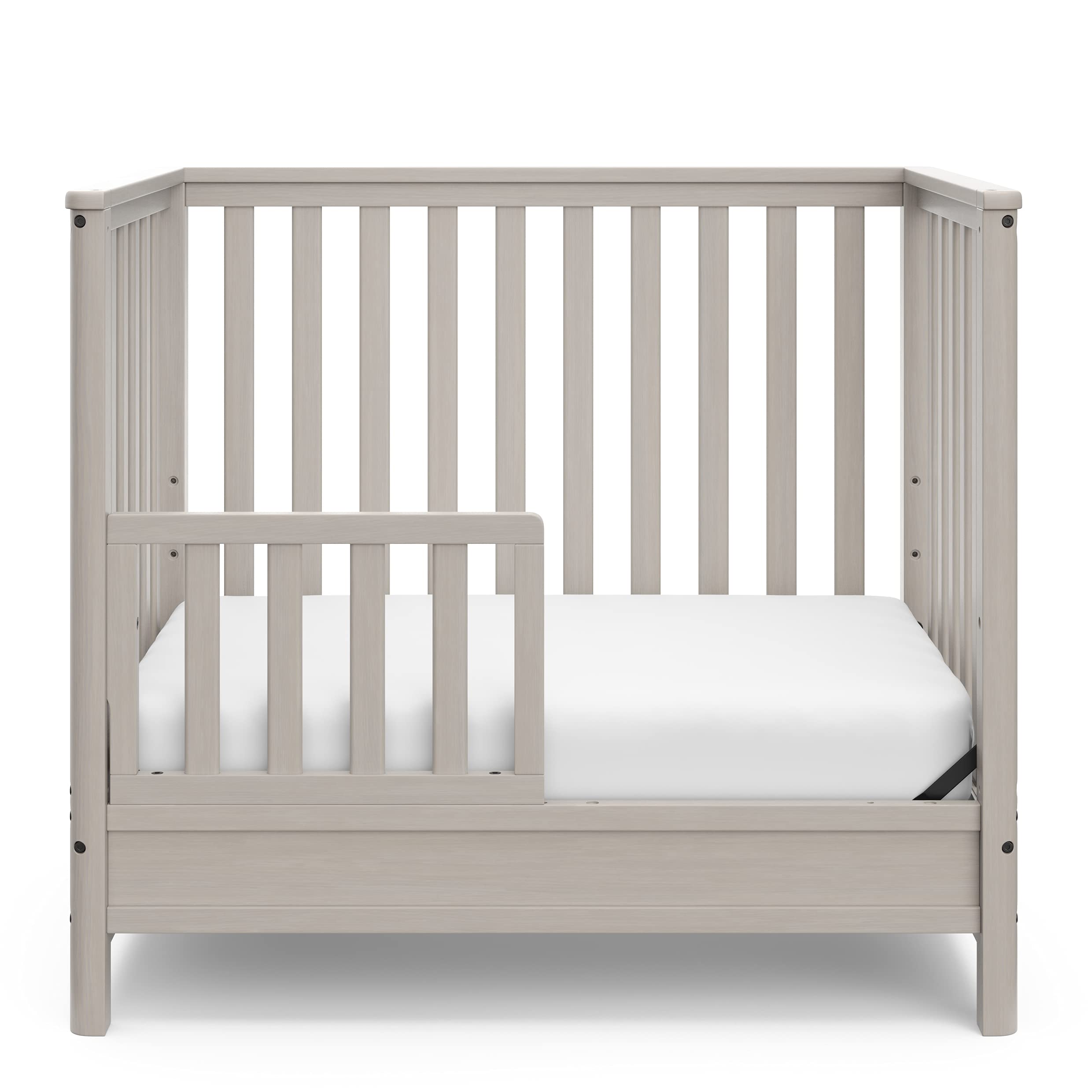 Storkcraft 5-in-1 Convertible Mini Crib with Bonus 2.75