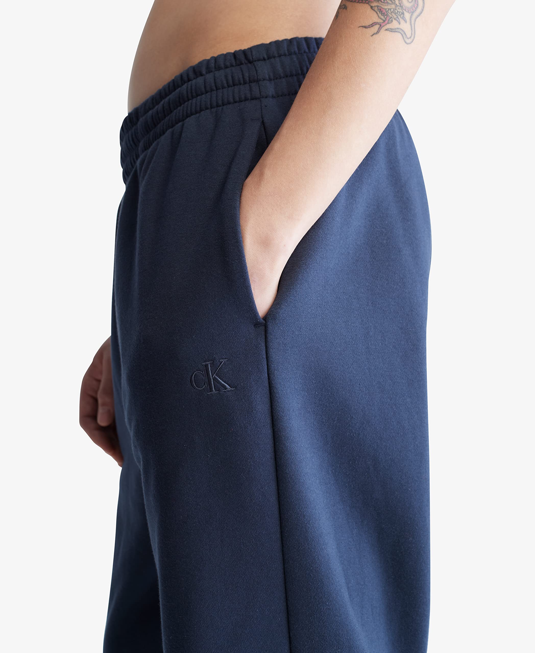 Calvin Klein Men's Fleece Jogger Pants with Logo - Soft Comfortable Lounge Pants for Casual Wear, Gym, and Home Relaxation