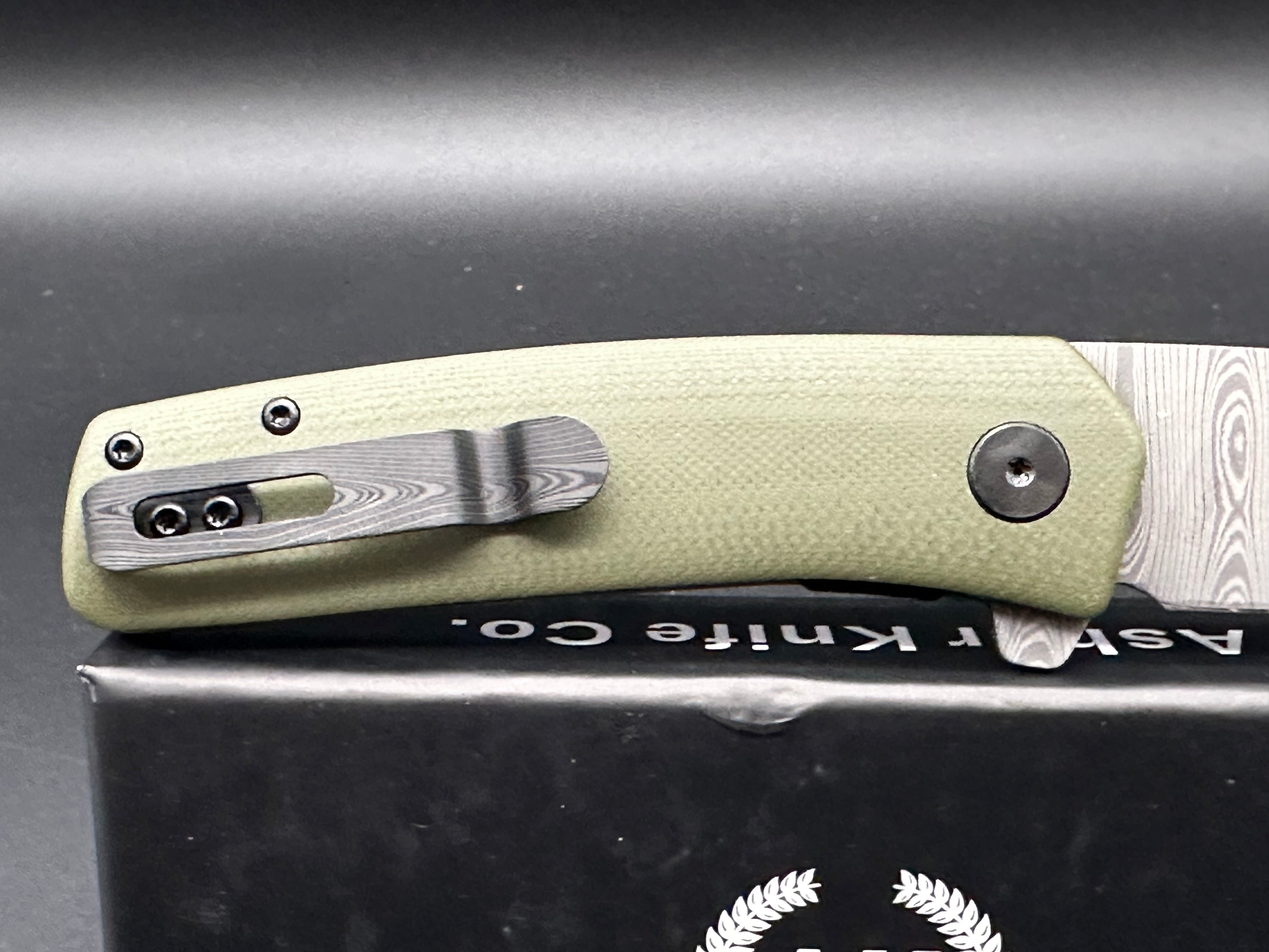 Asher Knives The Spiro Flipper Folding Pocket Knife - OD Green G10 Handle, S35VN Steel Blade, Laser Ladder Damascus Pattern - EDC, Outdoor, Camping, Survival Gear