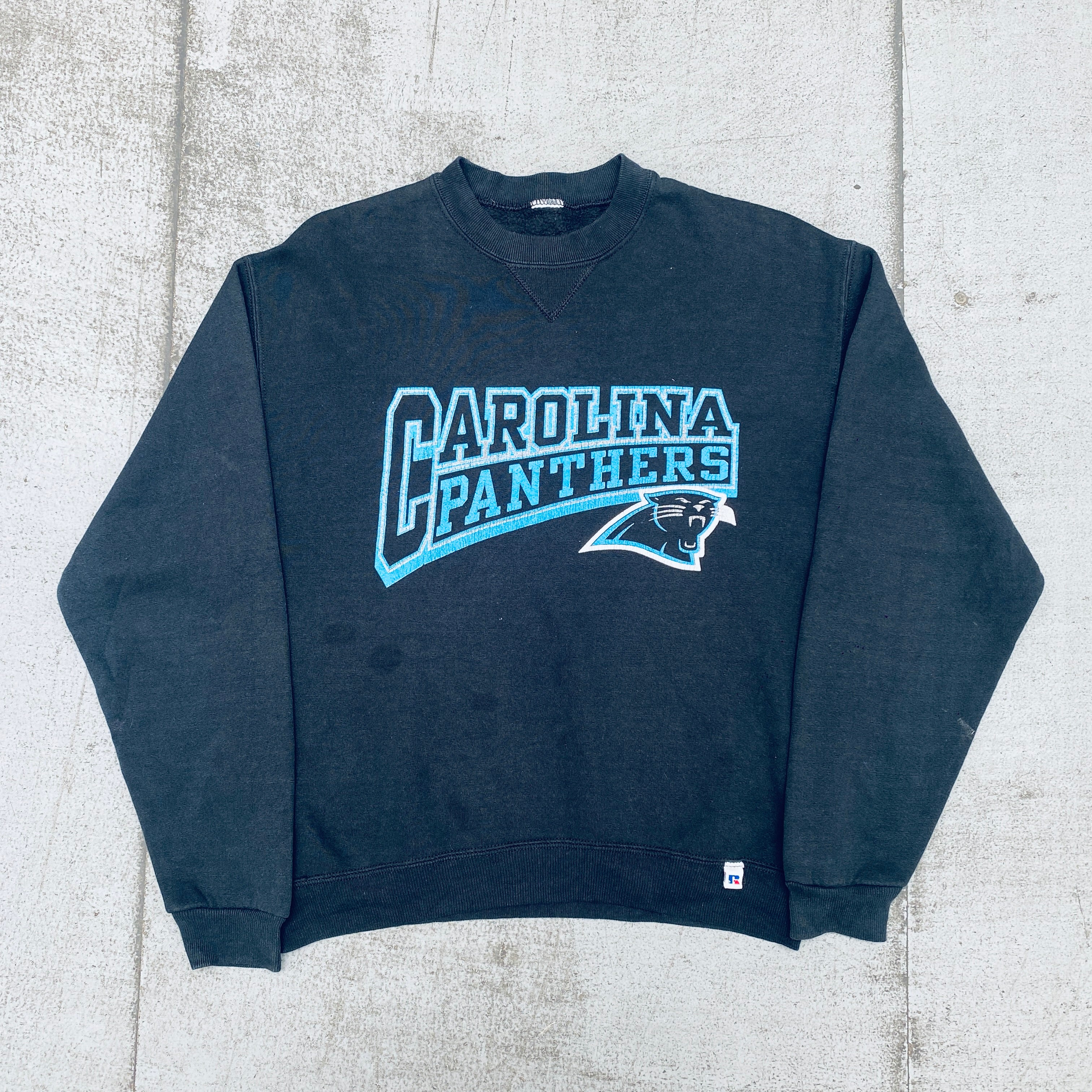 Vintage 1990s Carolina Panthers Russell Athletic Graphic Spellout Sweatshirt - S/M - NFL Fan Gear & Retro Sports Apparel for Game Day, Collectors, and 90s Nostalgia Fashion