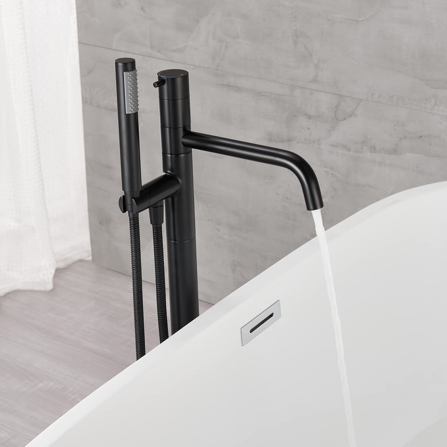 Freestanding Bathtub Faucet - Black Floor Mount Brass Single Handle Tub Filler with Hand Shower for Modern Bathroom | Perfect for Spa-Like Relaxation & Luxury Bathing Experience