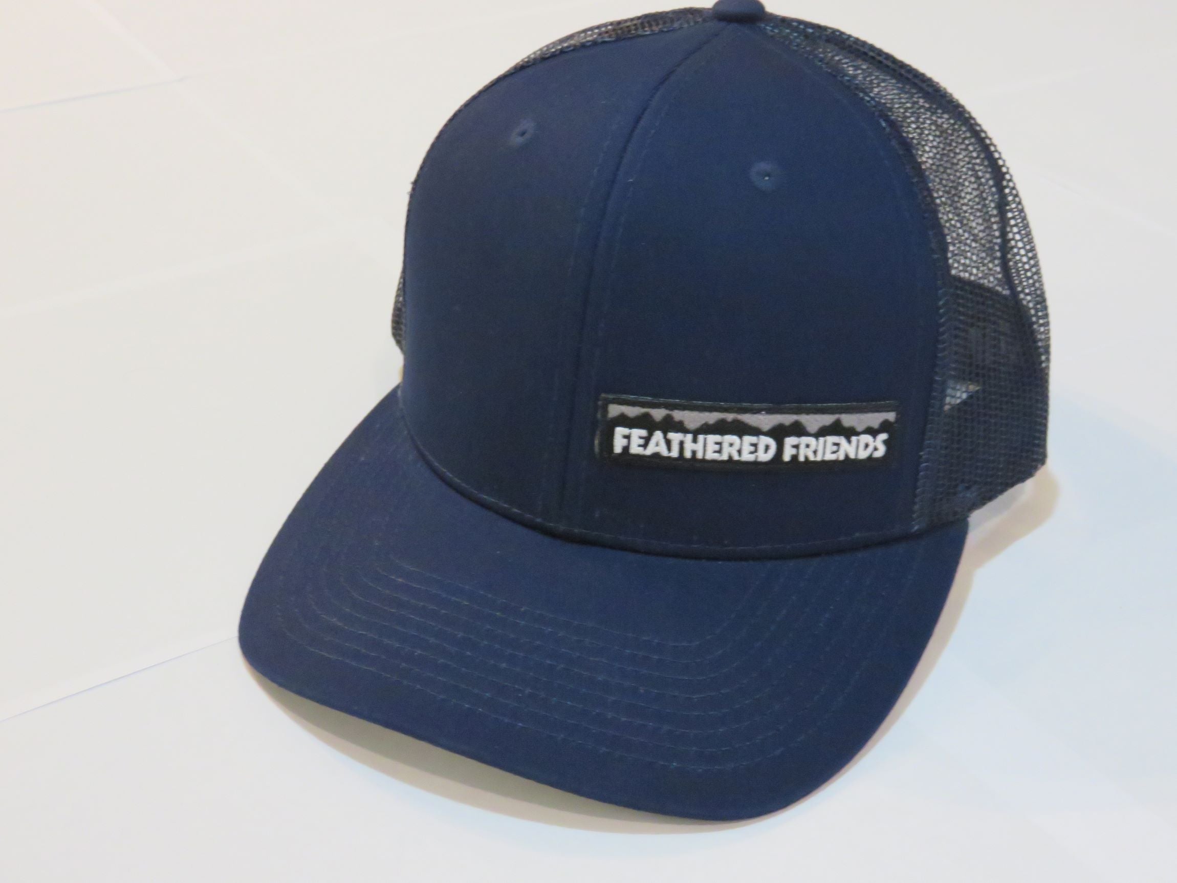 Feathered Friends Pro Style Trucker Offset Mountain Logo Patch Hat - Stylish Adjustable Cap for Outdoor Adventures, Hiking & Casual Wear