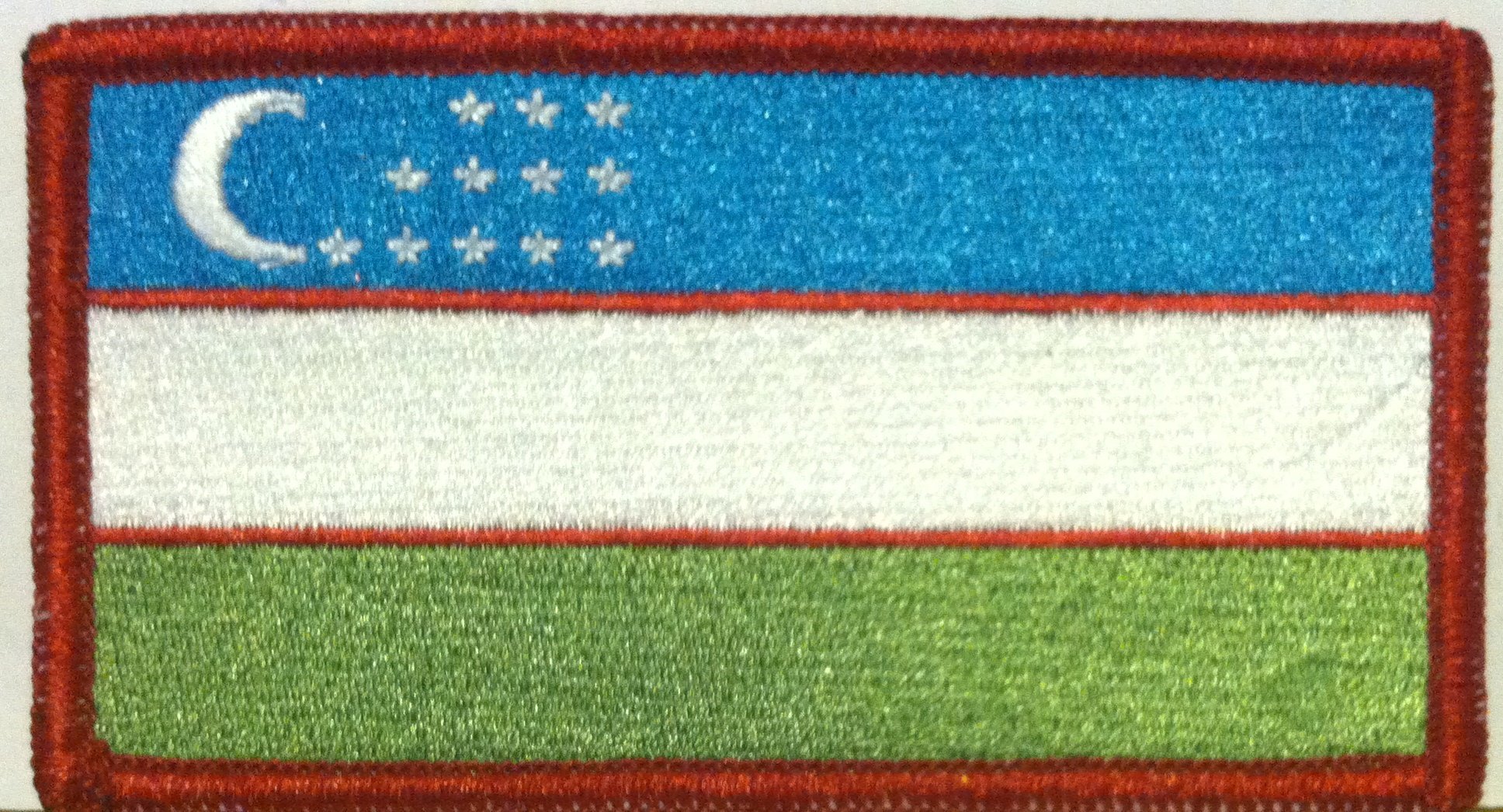 Uzbekistan Flag Iron-on Patch with Red Merrow Border - Durable Biker Emblem for Jackets, Vests & Backpacks - Perfect for Motorcycle Clubs, Travel Gear & Patriotic DIY Projects