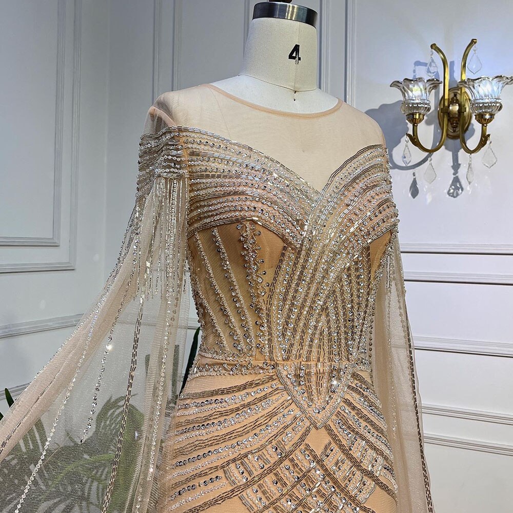 Elegant Beaded Mermaid Evening Gown with Cape Sleeves - Arabic Inspired Nude Luxury Dress for Women 2025 | Perfect for Weddings, Galas & Formal Parties