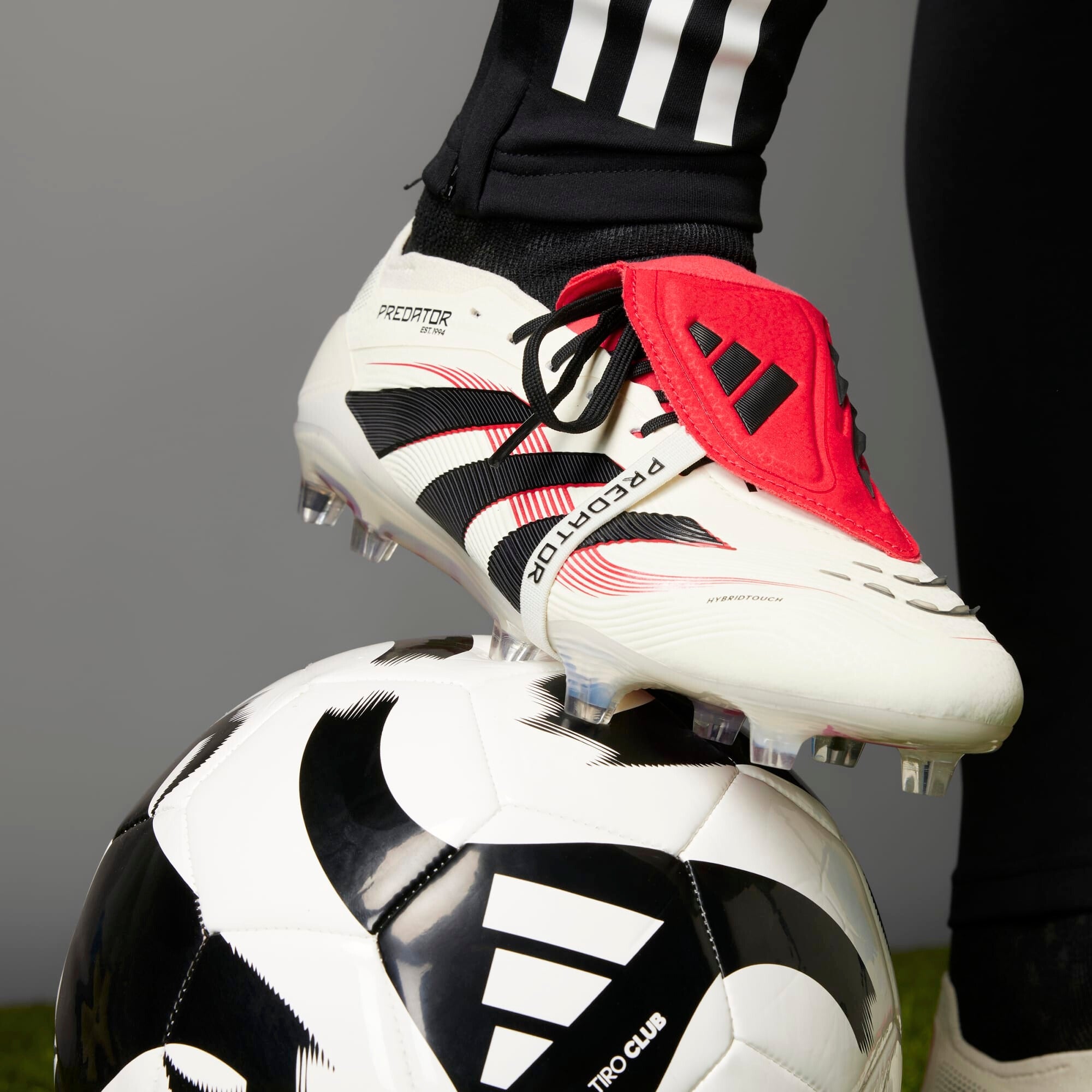 **adidas Predator Elite Fold Over Tongue Soccer Cleats - Lightweight & Comfortable for Football Training & Matches**    *(Use Case: Perfect for competitive soccer players seeking superior traction and support on firm ground surfaces.)*