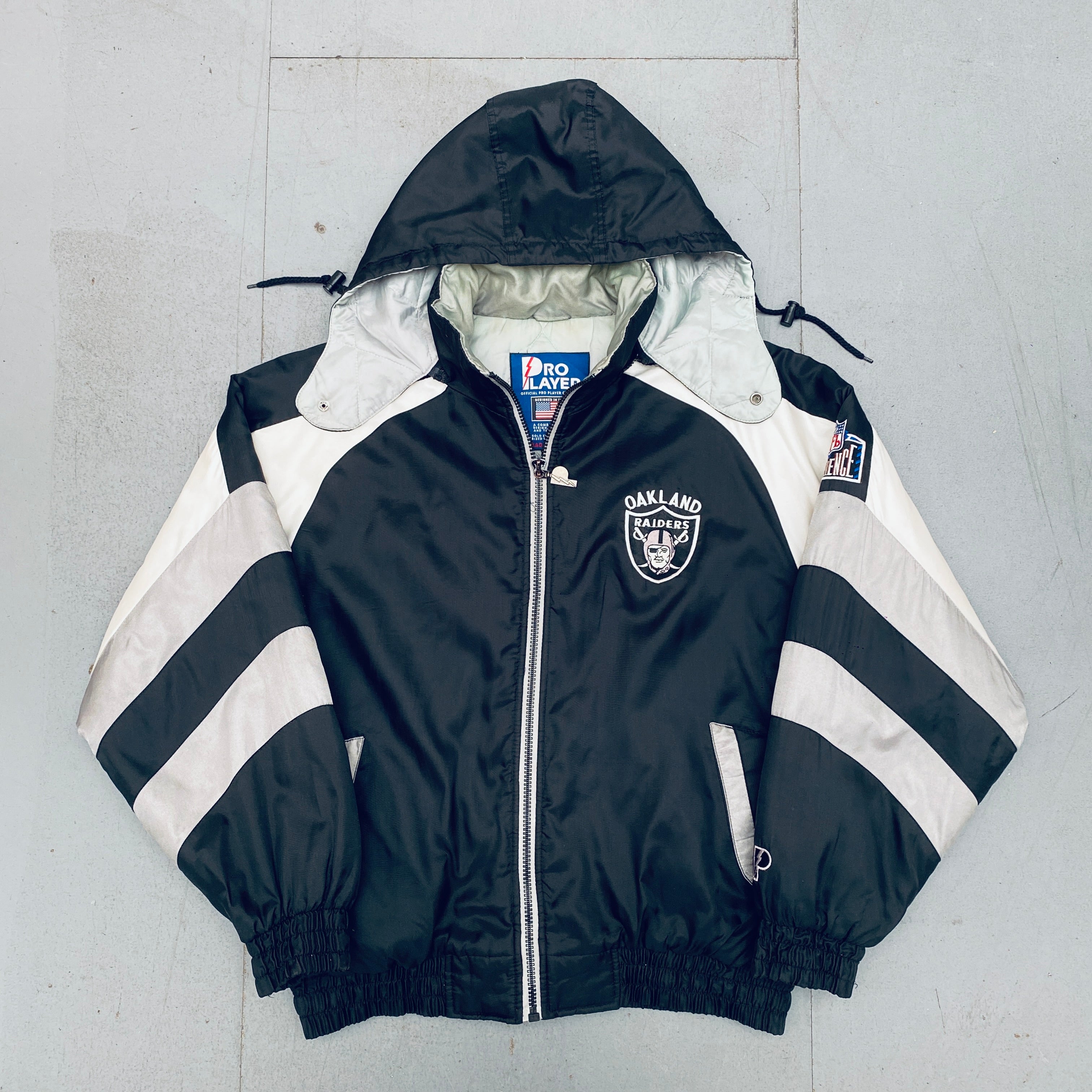 Oakland Raiders 1990s Pro Player Reverse Spellout Full-Zip Jacket - XL Size | Vintage NFL Football Fan Gear for Game Day & Casual Wear