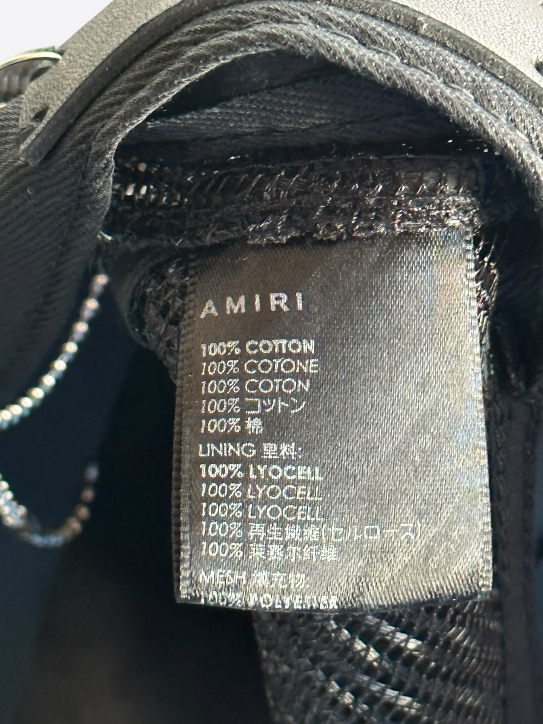Amiri Black MA Paint Splatter Logo Trucker Hat - Stylish Distressed Baseball Cap for Men & Women - Perfect for Streetwear, Concerts, and Casual Outfits