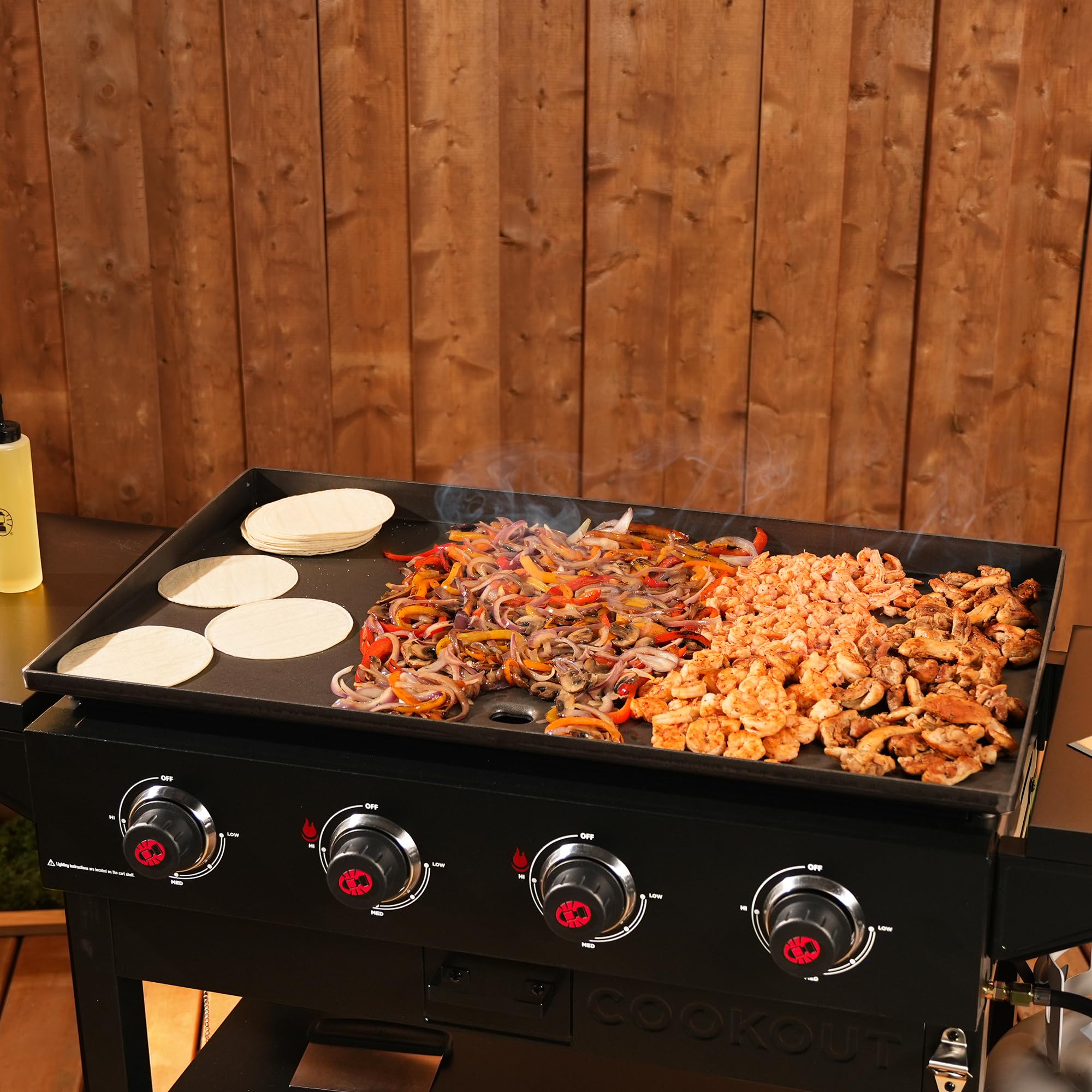 Coleman Cookout 4-Burner 60,000 BTU Propane Gas Grill Griddle Station - 720 Sq. In. Cooking Surface with Grease Tray, 2 Side Shelves & 4-Wheel Cart - Outdoor BBQ, Camping & Tailgating Grill for Backyard & Picnic Cooking
