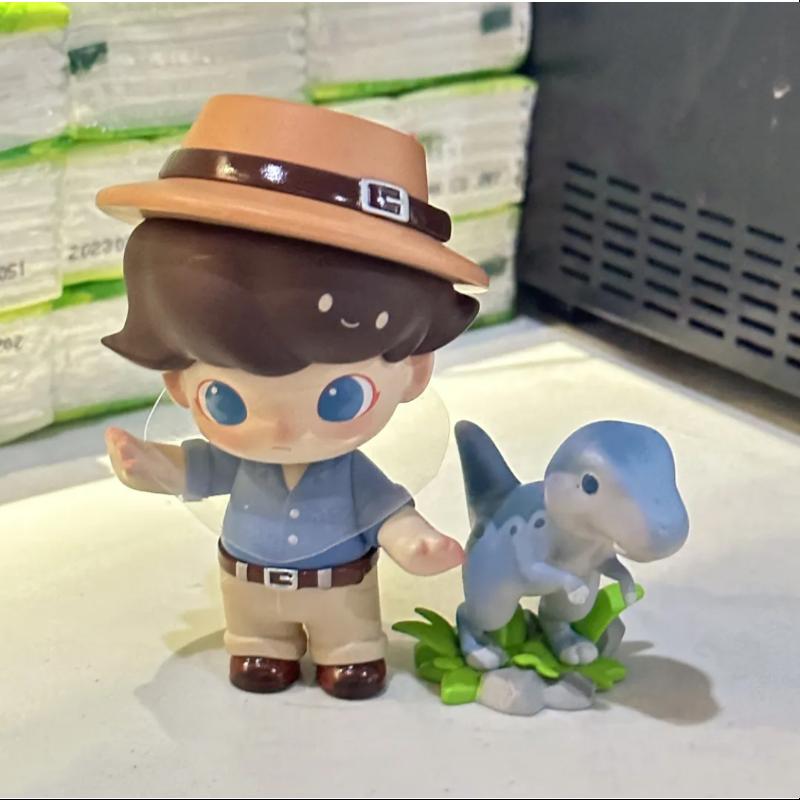 DIMOO Jurassic World Series DINOSAUR TRAINER Collectible Figure - Official Licensed Dinosaur Toys for Kids & Adults - Perfect for Display, Gifts, and Jurassic World Fans Collection