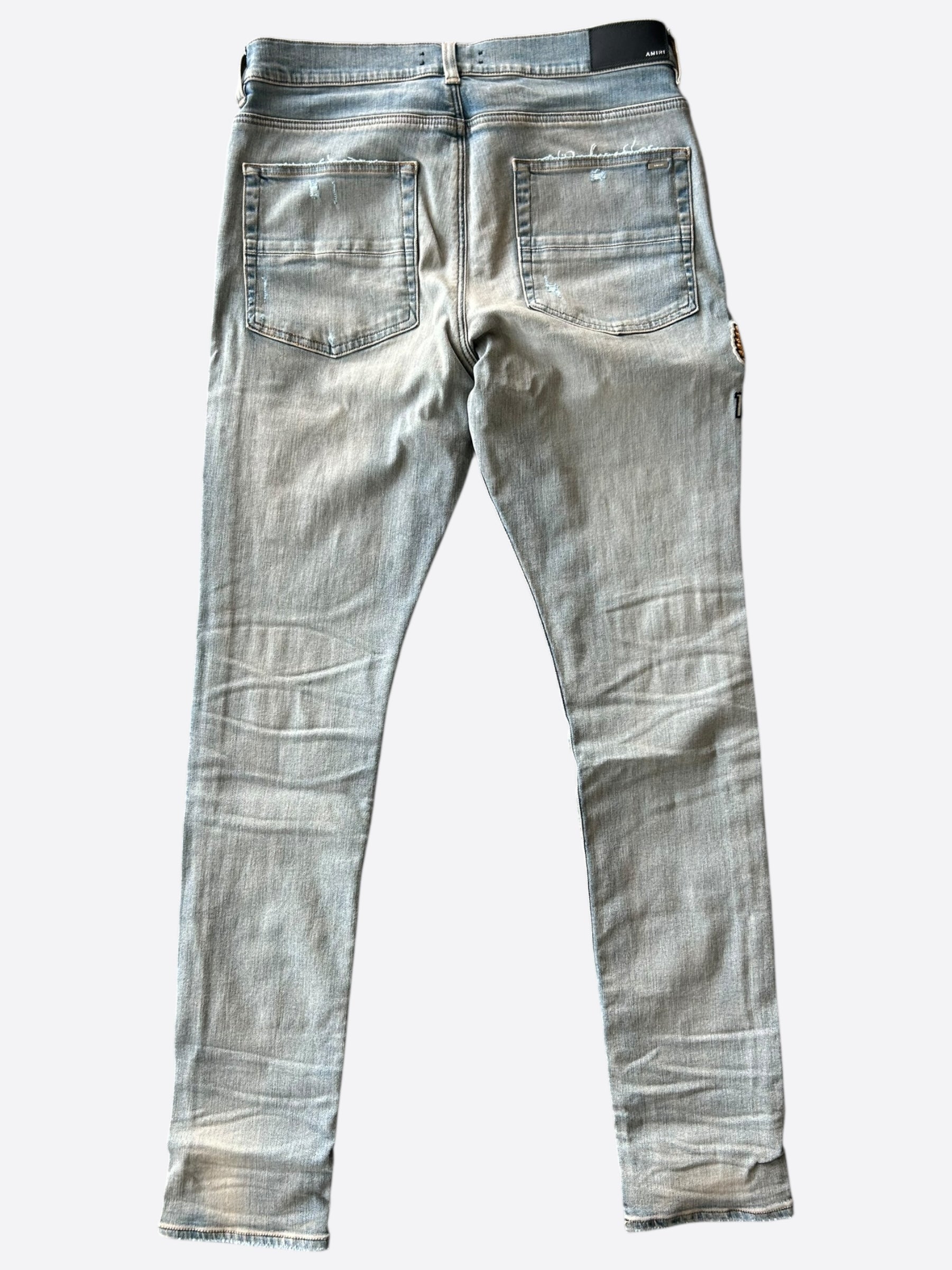 Amiri Antique Indigo Eagle Varsity Applique Logo Jeans for Men - Vintage Denim Pants with Embroidered Patch Design - Perfect for Casual Wear, Street Style & Night Out