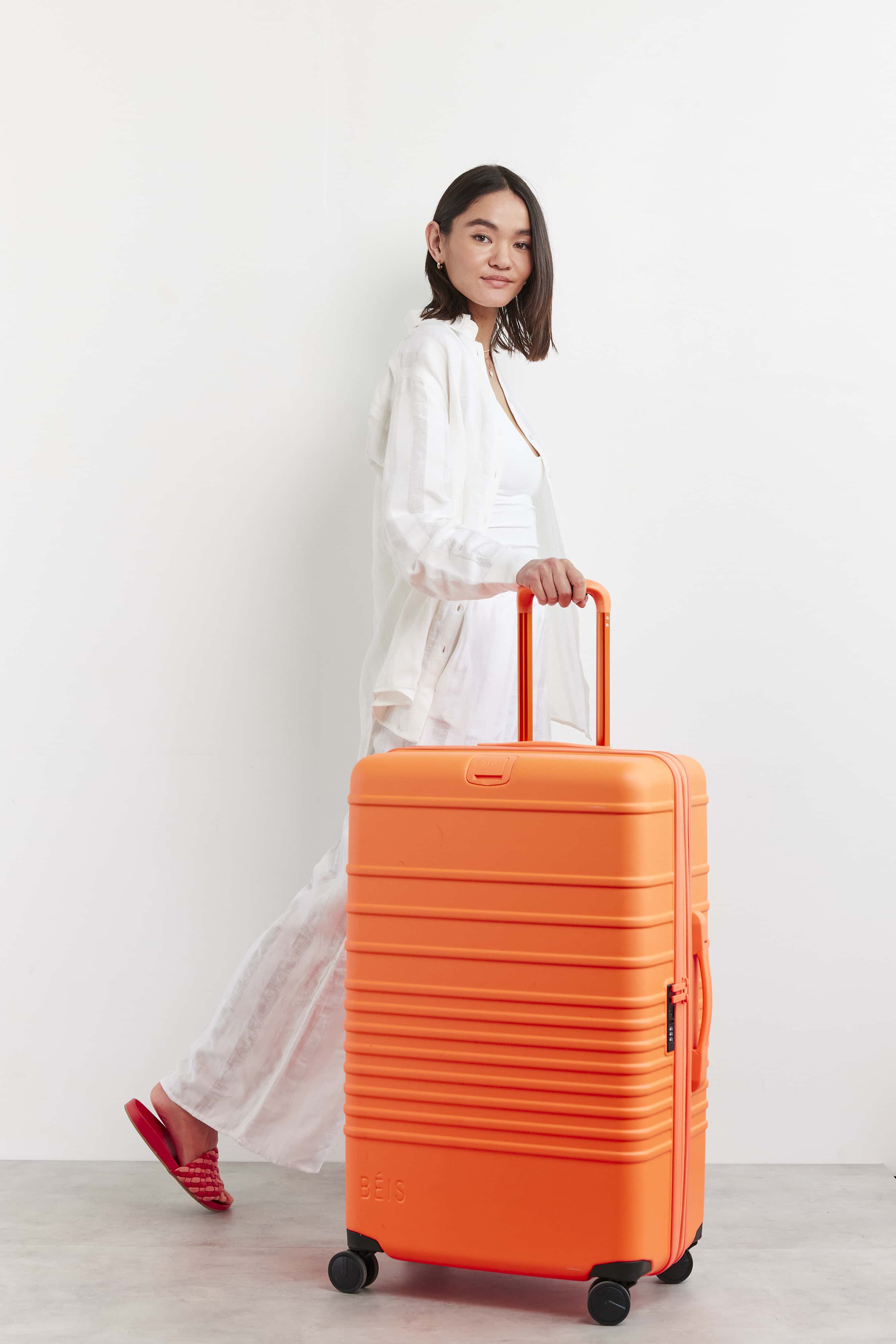 Large Check-In Roller Suitcase in Creamsicle - Spacious & Durable Travel Luggage for Airlines, Vacations & Business Trips