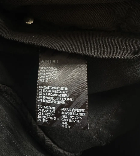 Amiri Aged Black Camouflage Patch MX1 Jeans for Men - Distressed Slim Fit Denim Pants | Streetwear & Casual Style
