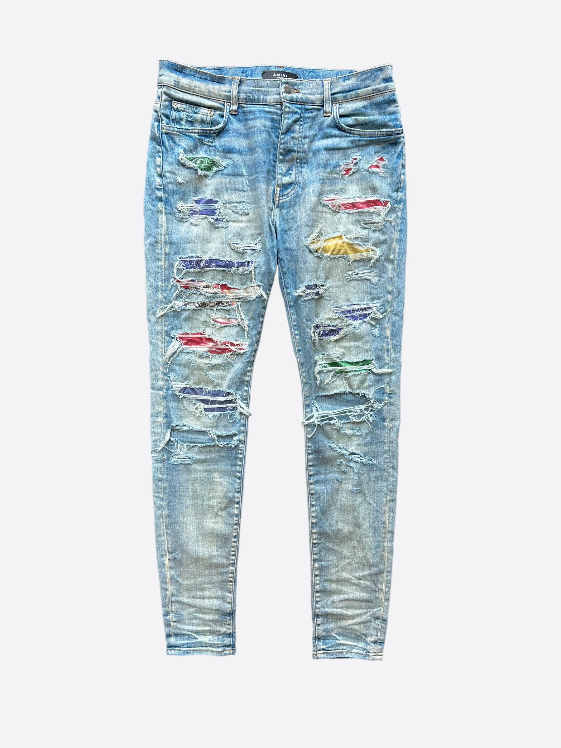 Amiri Blue Distressed Jeans with Multicolor Patches - Stylish Ripped Denim Pants for Men | Perfect for Casual Outfits, Streetwear & Night Out Looks
