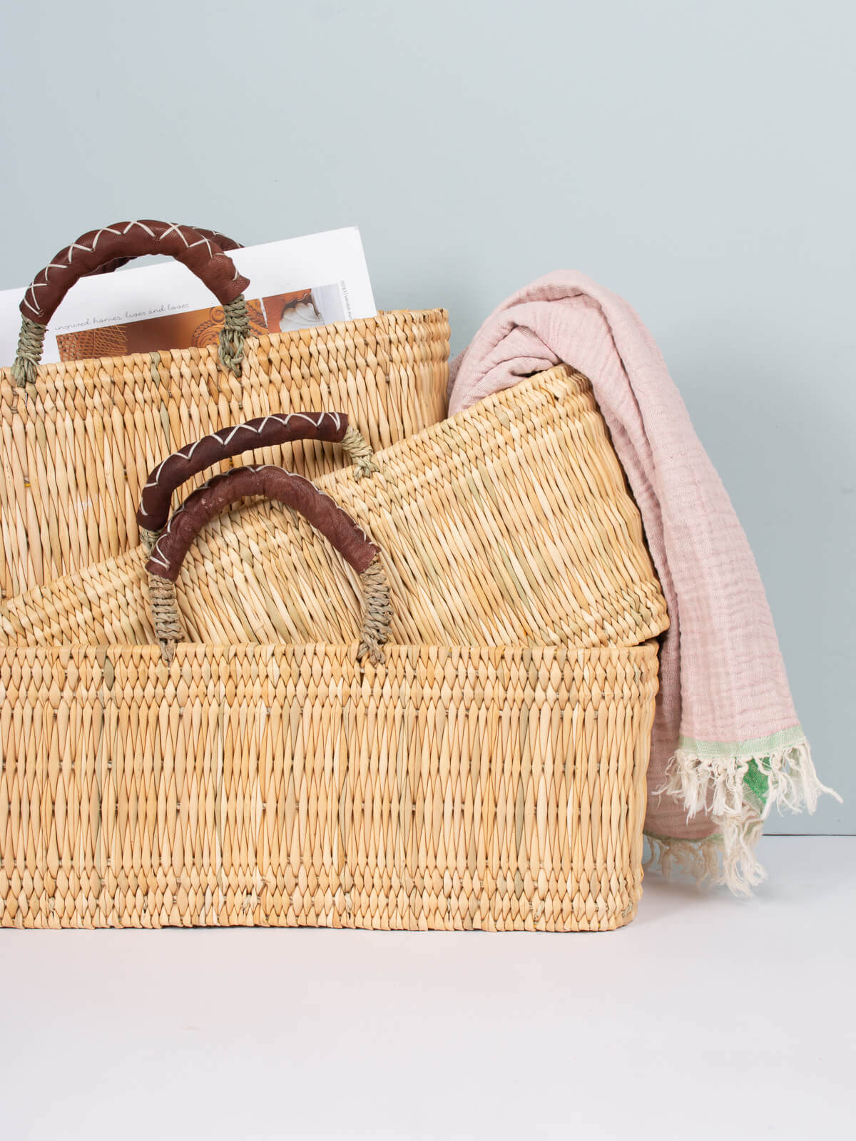 Handwoven Reed Basket with Genuine Leather Handles - Natural Woven Storage Bin for Home Decor, Laundry, or Picnic Basket - Perfect for Organizing Blankets, Toys, and More