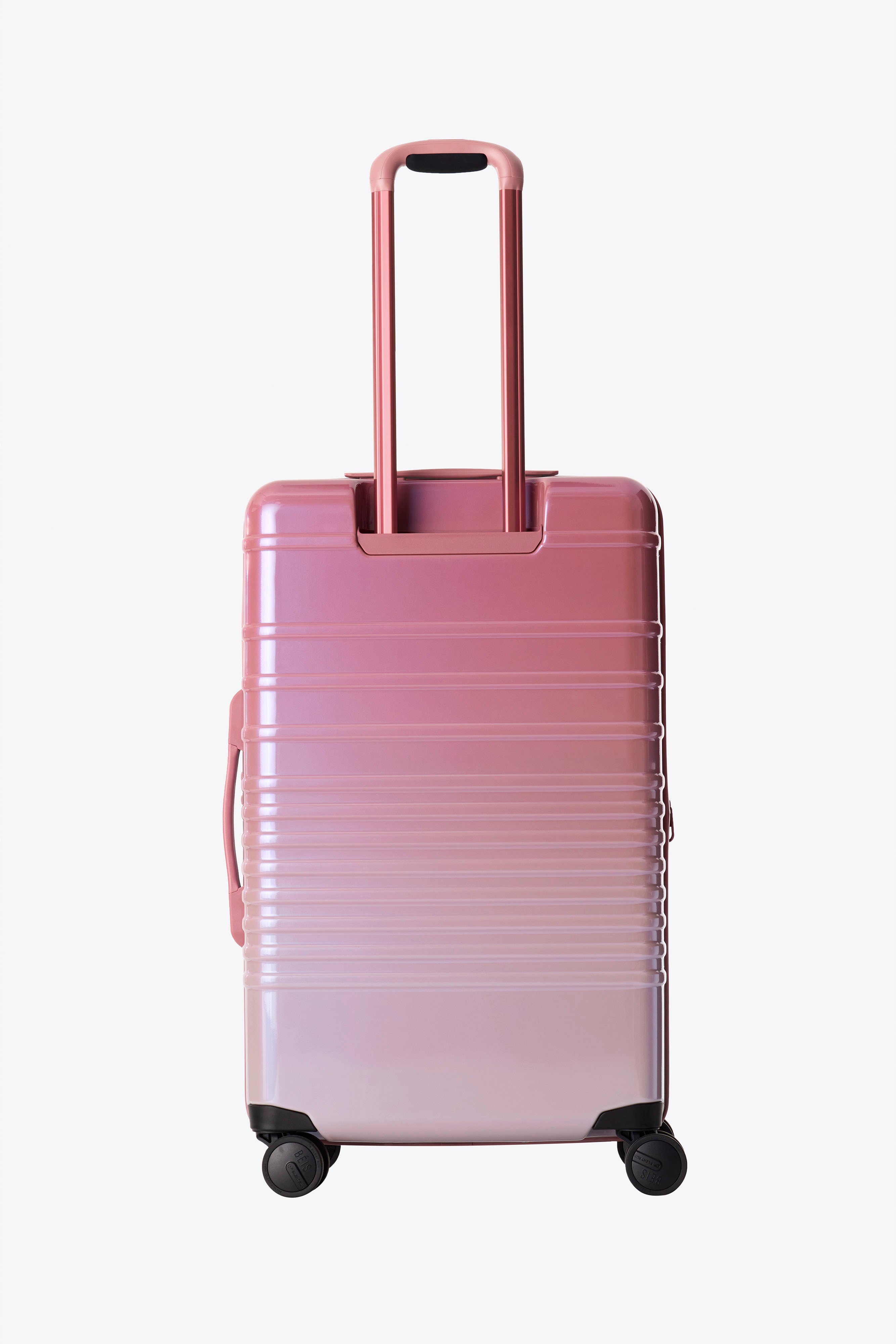 The Medium Check In Roller Luggage in Wicked Pink - Perfect for Business Travel & Weekend Getaways