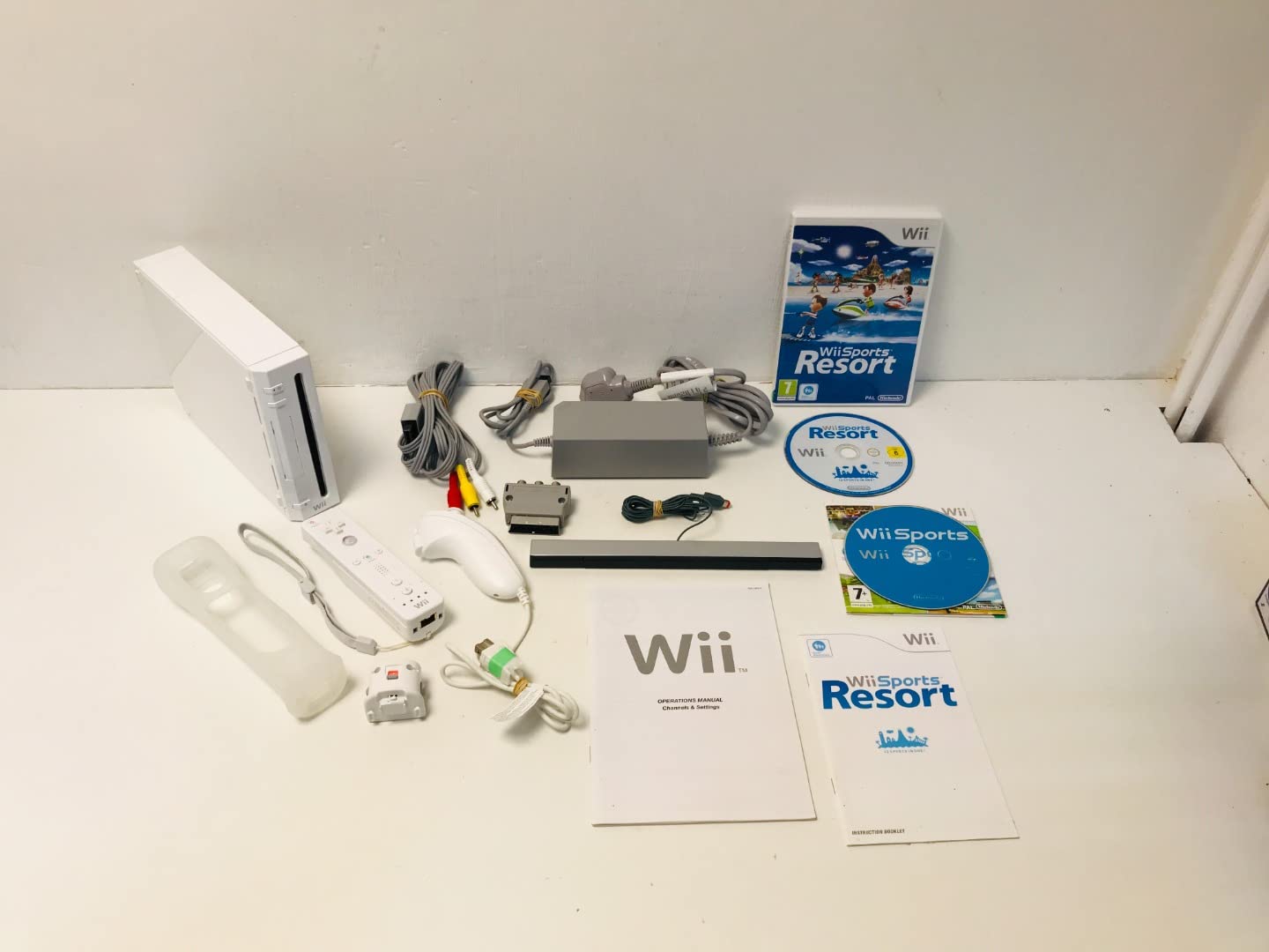 Nintendo Wii Console Bundle with Wii Sports & Wii Sports Resort Games - Includes Motion Plus Controller - Perfect for Family Fun & Multiplayer Gaming