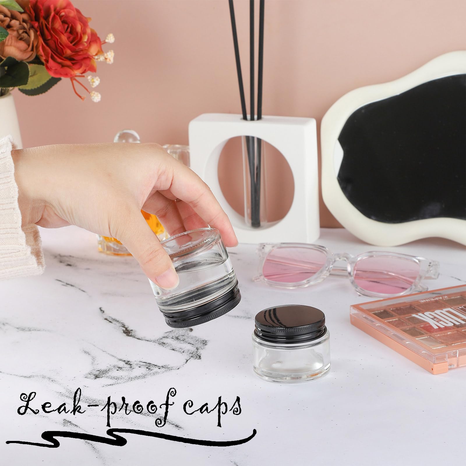 24 Pack 2oz Clear Glass Jars with Black Metal Lids - Small Empty Cosmetic Containers with Inner Liners - Travel-Sized Lotion Jars with Labels - Perfect for DIY Beauty Products, Travel Toiletries & Home Organization