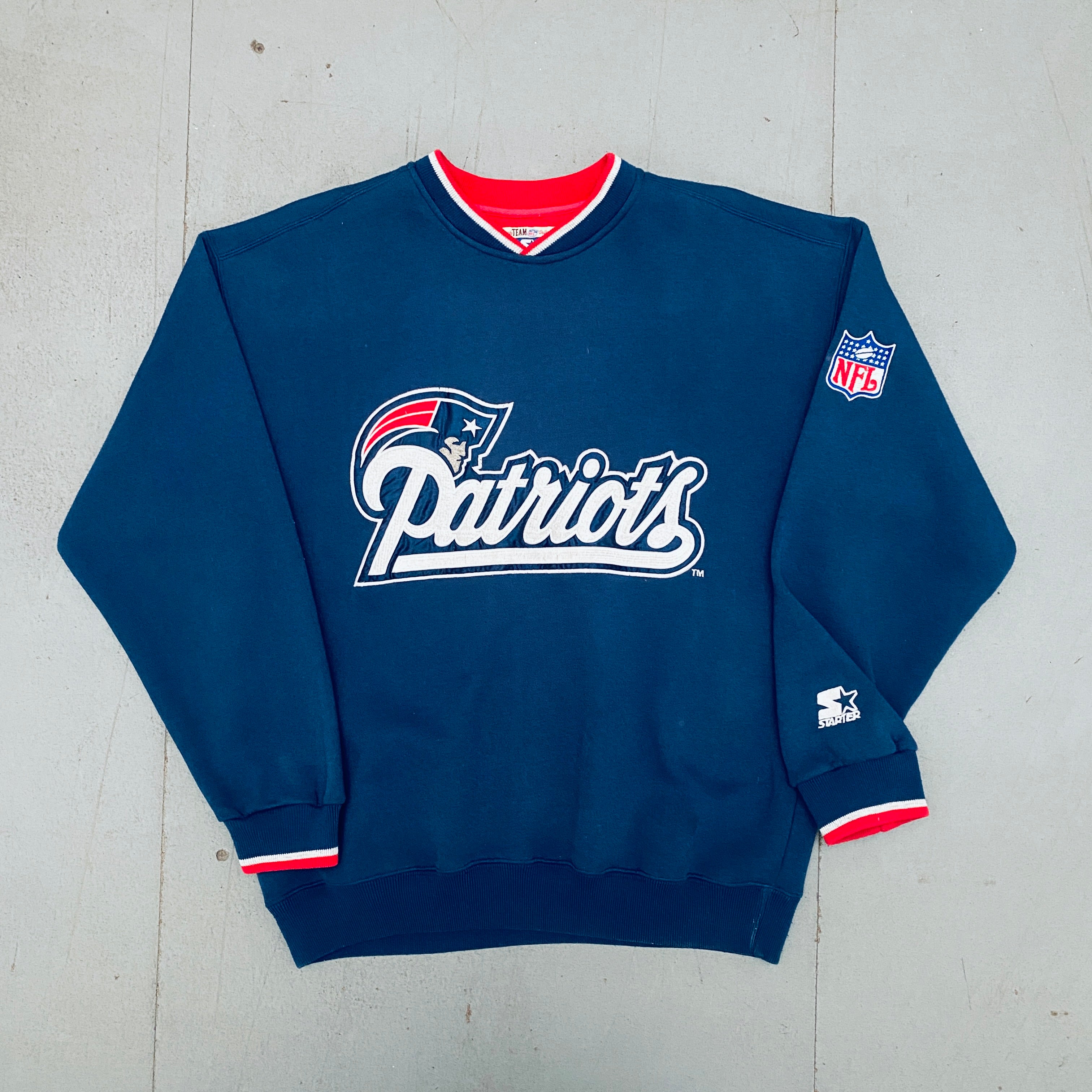 Vintage 1990s New England Patriots Embroidered Wordmark Spellout Starter Sweatshirt - Large Size | NFL Football Fan Apparel & Retro Sports Collectible for Men | Perfect for Game Day, Tailgating, and Patriots Memorabilia Collection