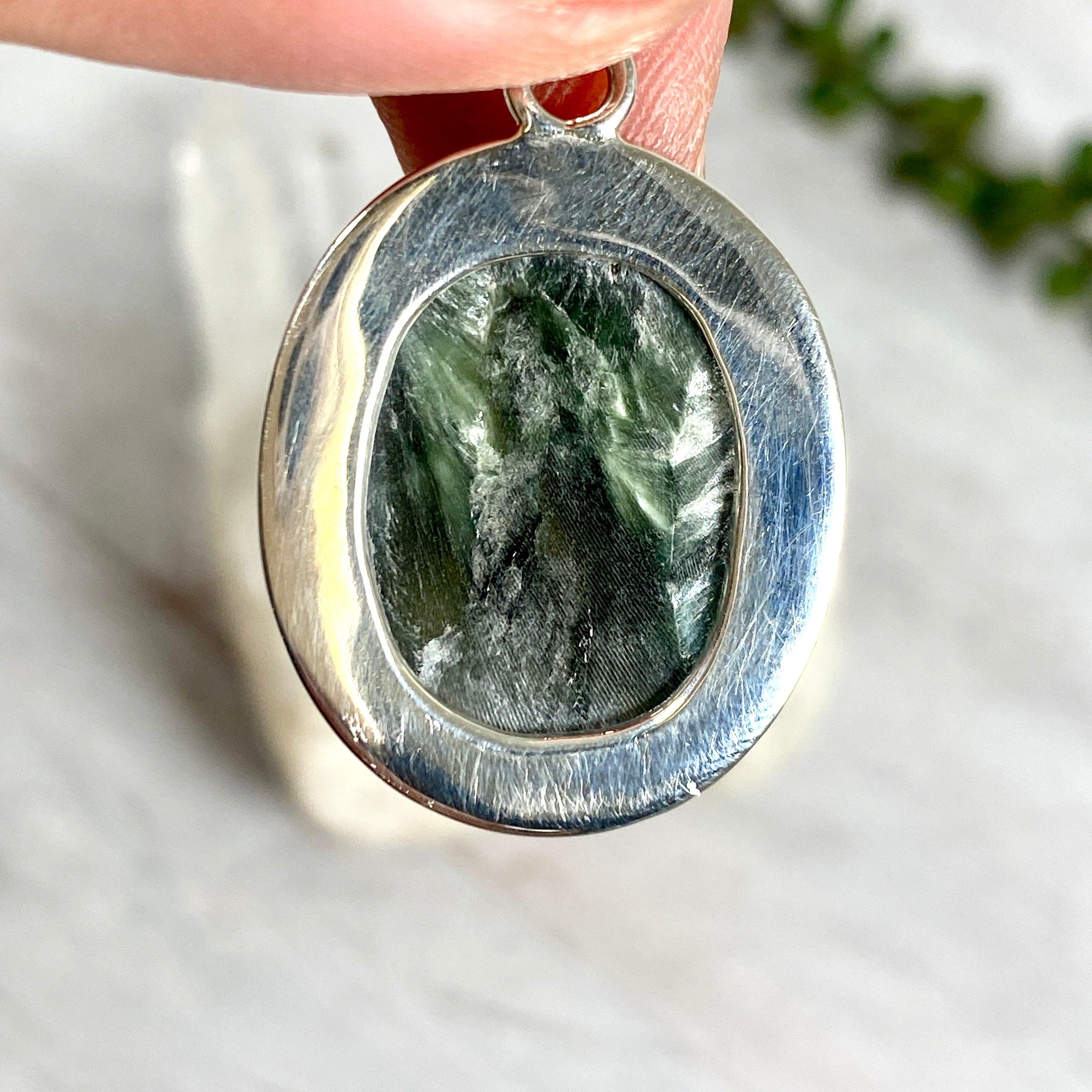 Natural Seraphinite Oval Cabochon Pendant with Handcrafted Beaten Banding - KPGJ2511 | Healing Crystal Jewelry for Meditation & Spiritual Gifts