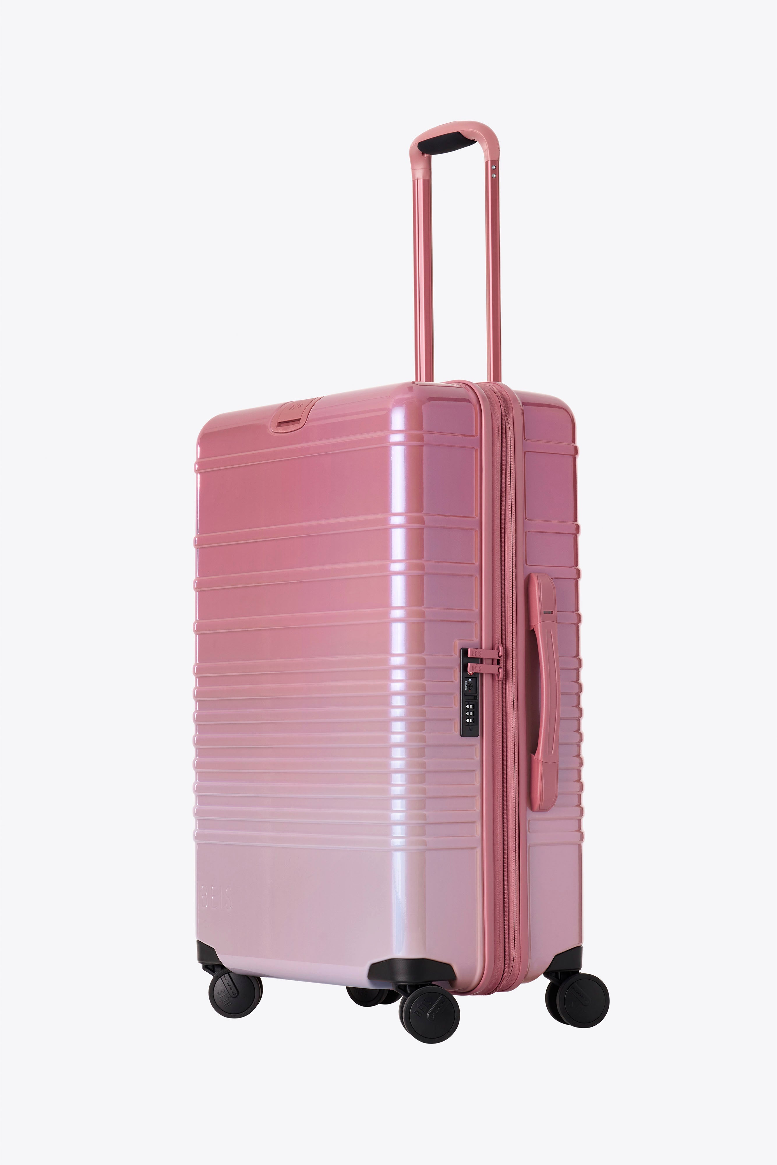 The Medium Check In Roller Luggage in Wicked Pink - Perfect for Business Travel & Weekend Getaways