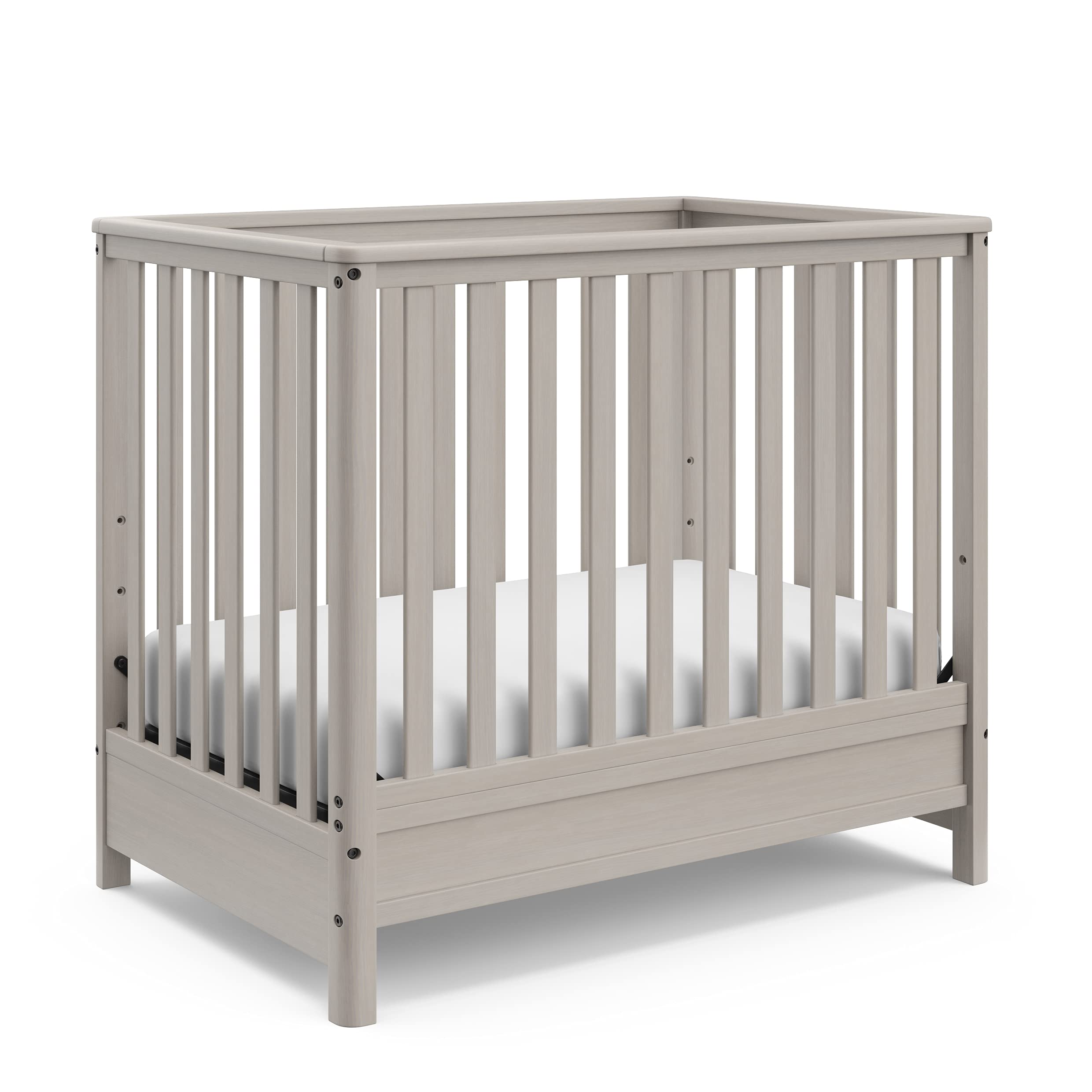 Storkcraft 5-in-1 Convertible Mini Crib with Bonus 2.75
