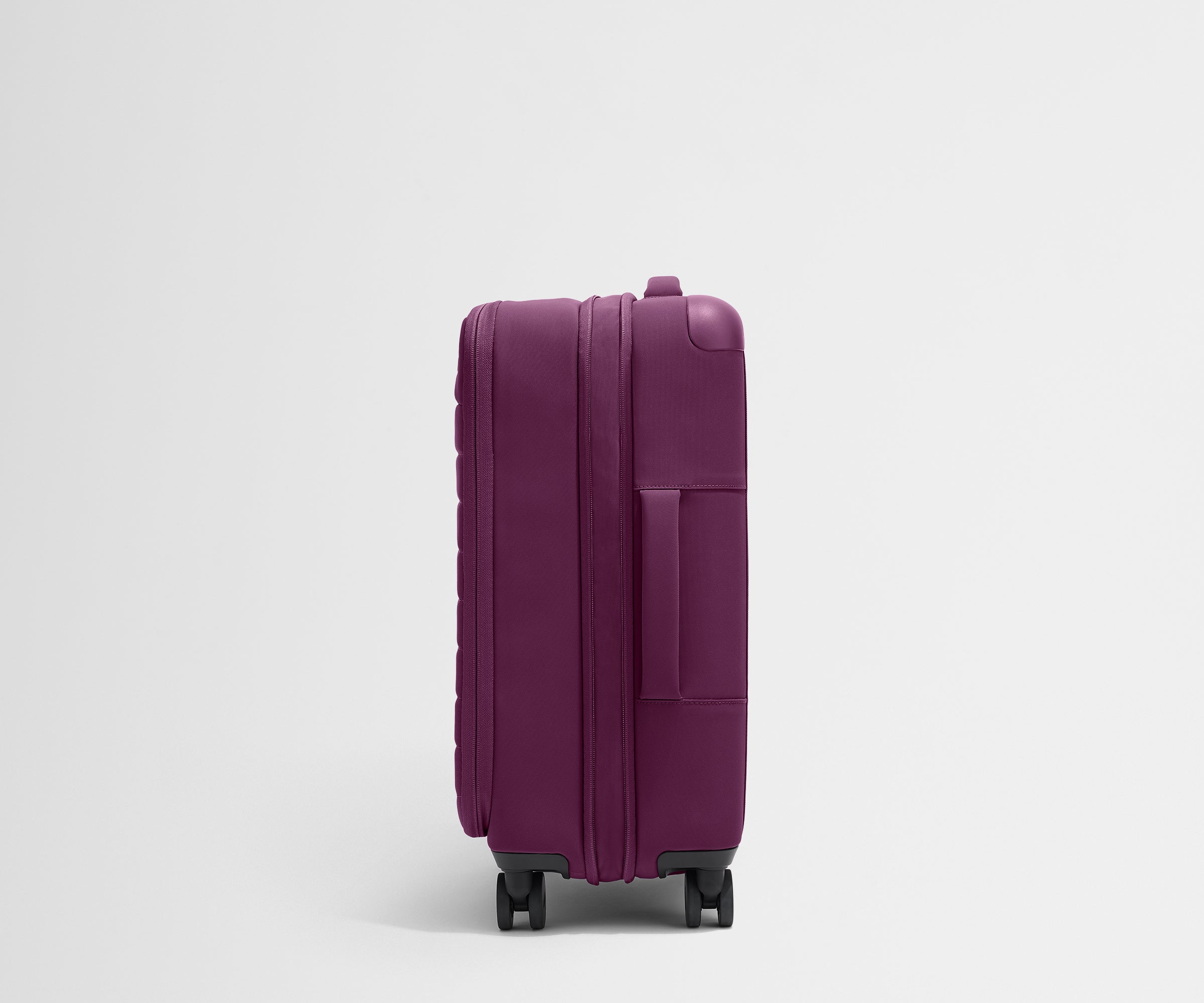 Softside Bigger Carry On Luggage in Plum Purple - Lightweight Expandable Suitcase for Air Travel & Weekend Getaways