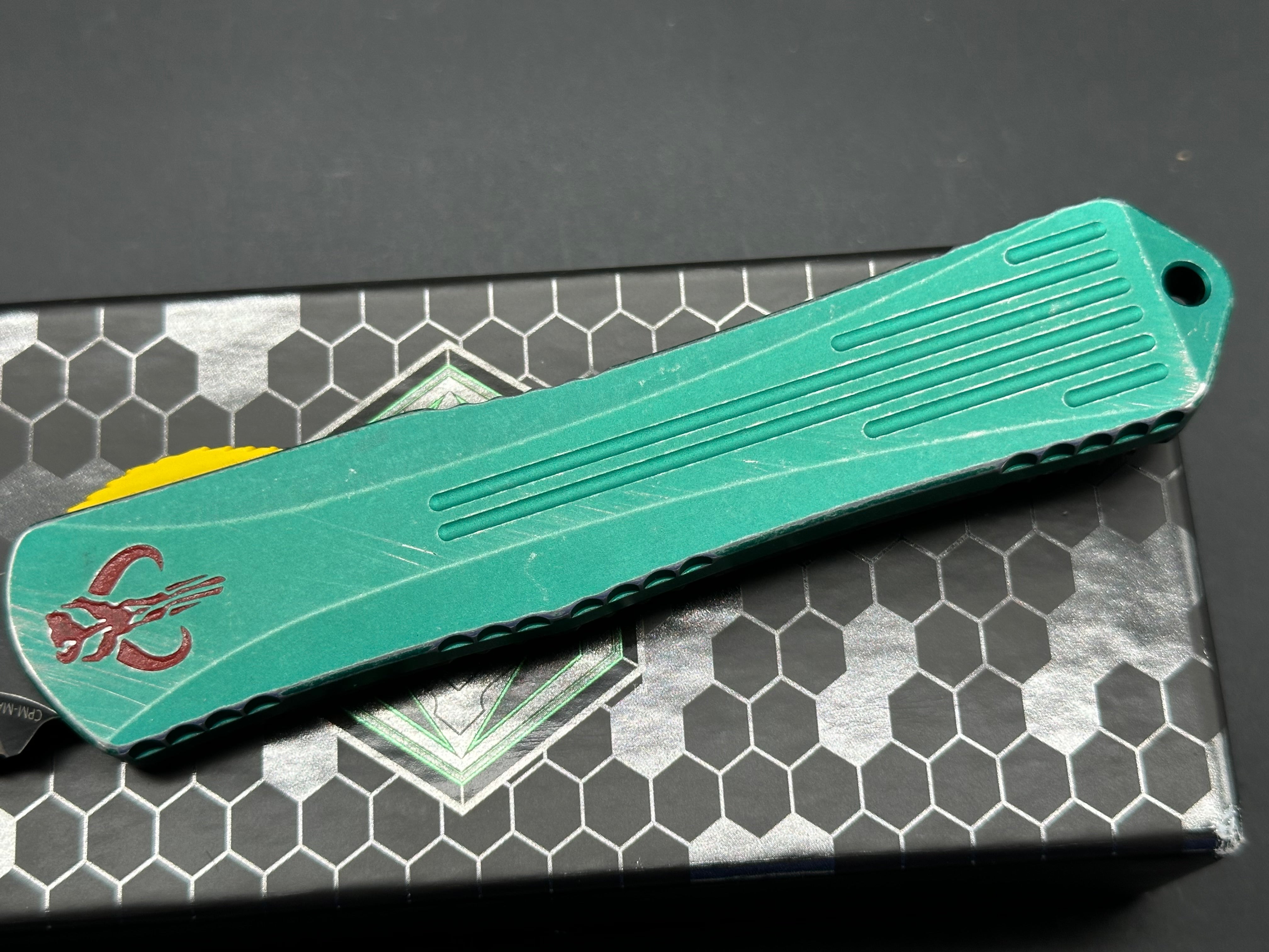 Heretic Manticore X Bounty Hunter Camo Carbon Handle OTF Knife - Black MagnaCut Serrated Tanto Blade for Tactical, Outdoor & EDC Use