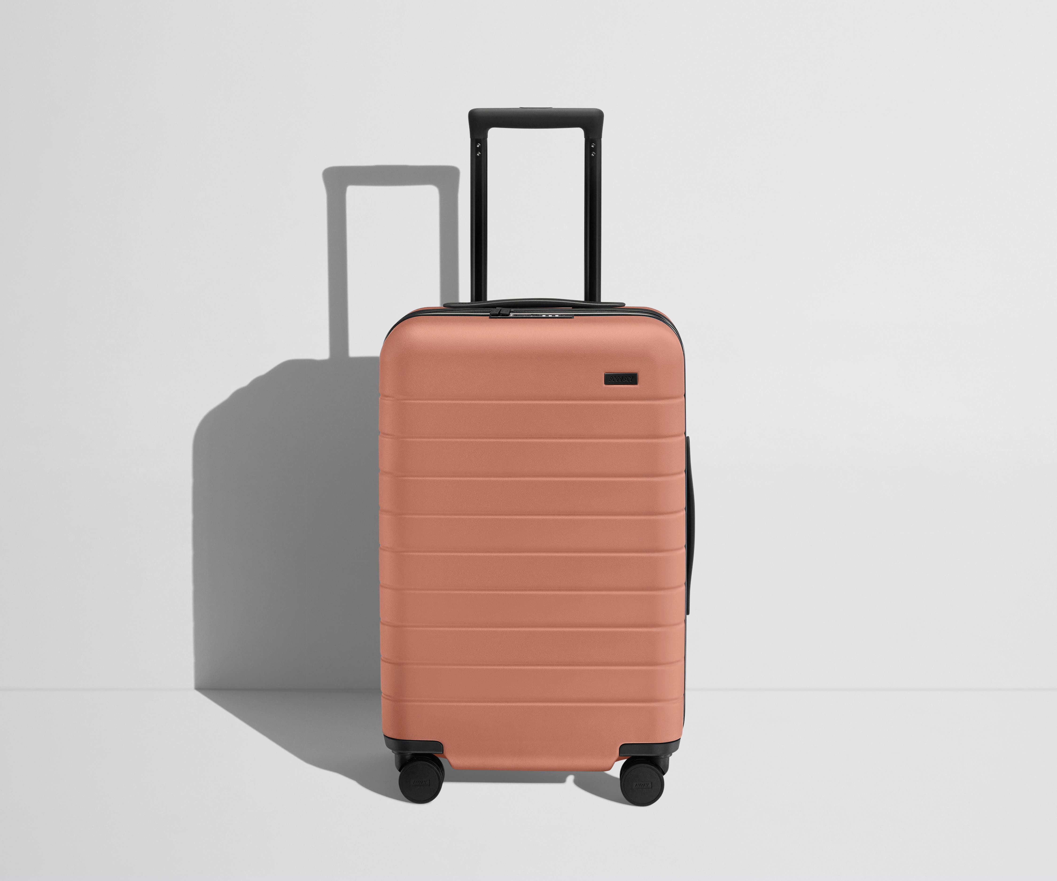 The Carry On Flex in Clay Pink - Lightweight Expandable Luggage for Travel, Business Trips & Weekend Getaways