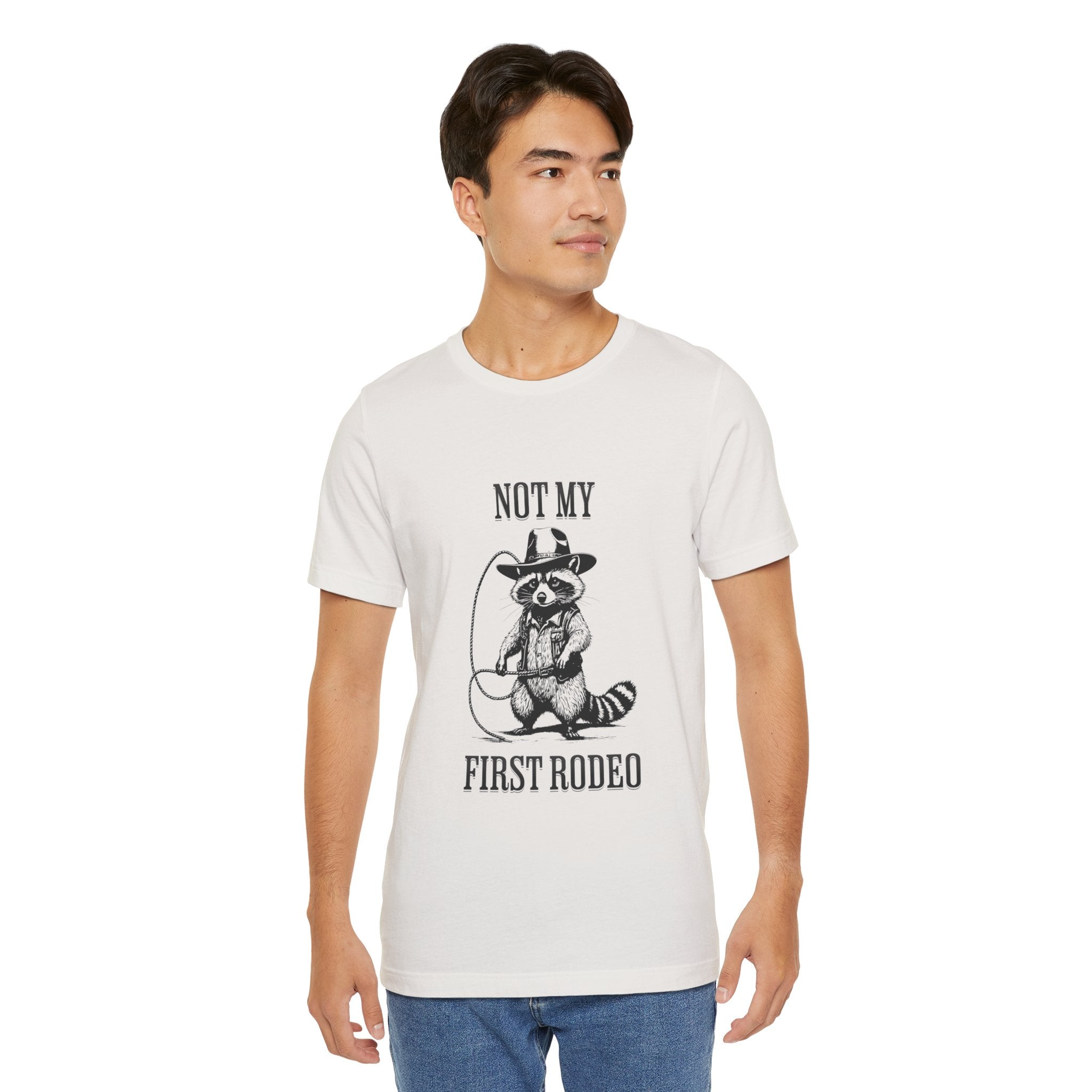 Funny Western Graphic Cotton Tee - Not My First Rodeo Cowboy Raccoon Shirt | Cute Quirky Country Style T-Shirt for Rodeo Fans & Animal Lovers | Perfect for Rodeo Events, Country Concerts & Casual Wear