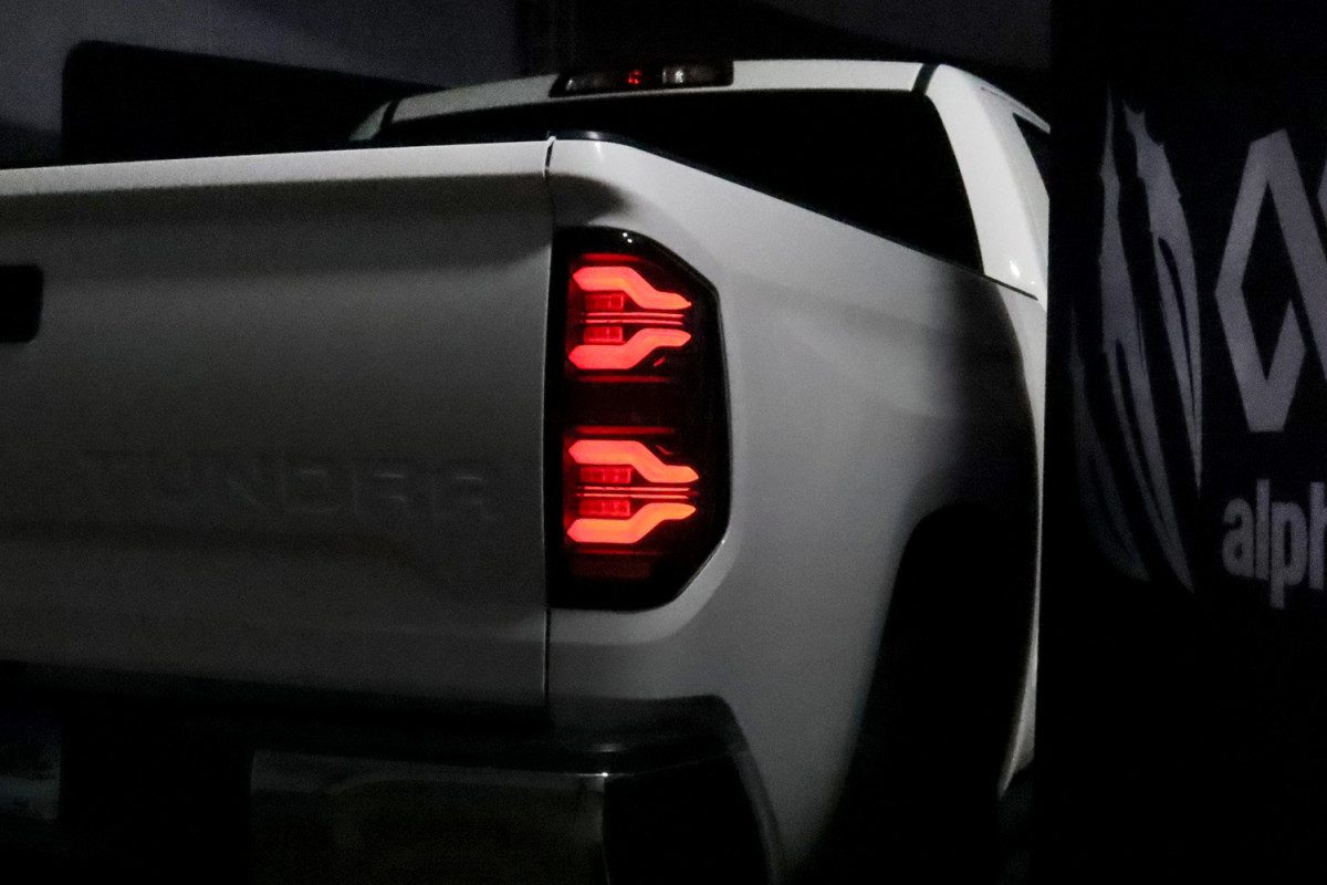 14-21 Toyota Tundra LUXX Series LED Tail Lights - Alpha Black - Smoked Lens - Plug & Play Installation - Upgrade Your Truck's Style & Visibility for Night Driving