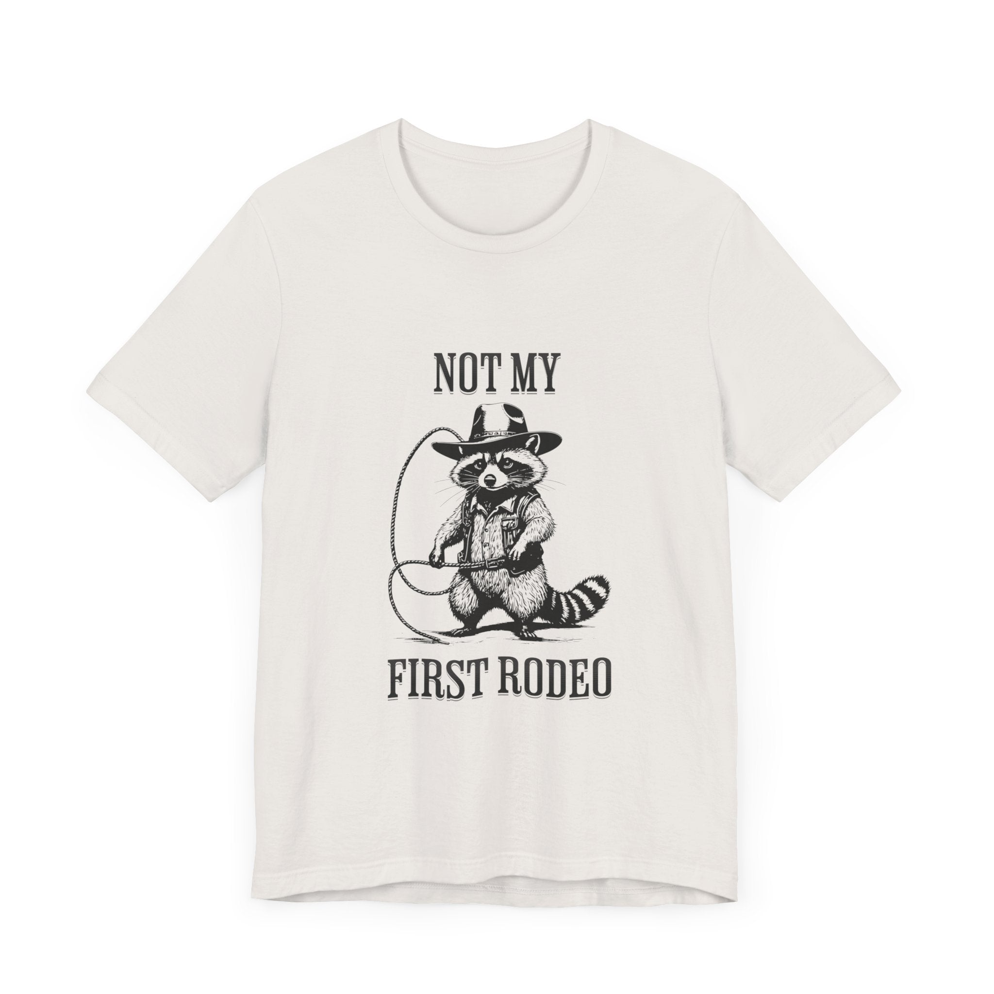 Funny Western Graphic Cotton Tee - Not My First Rodeo Cowboy Raccoon Shirt | Cute Quirky Country Style T-Shirt for Rodeo Fans & Animal Lovers | Perfect for Rodeo Events, Country Concerts & Casual Wear
