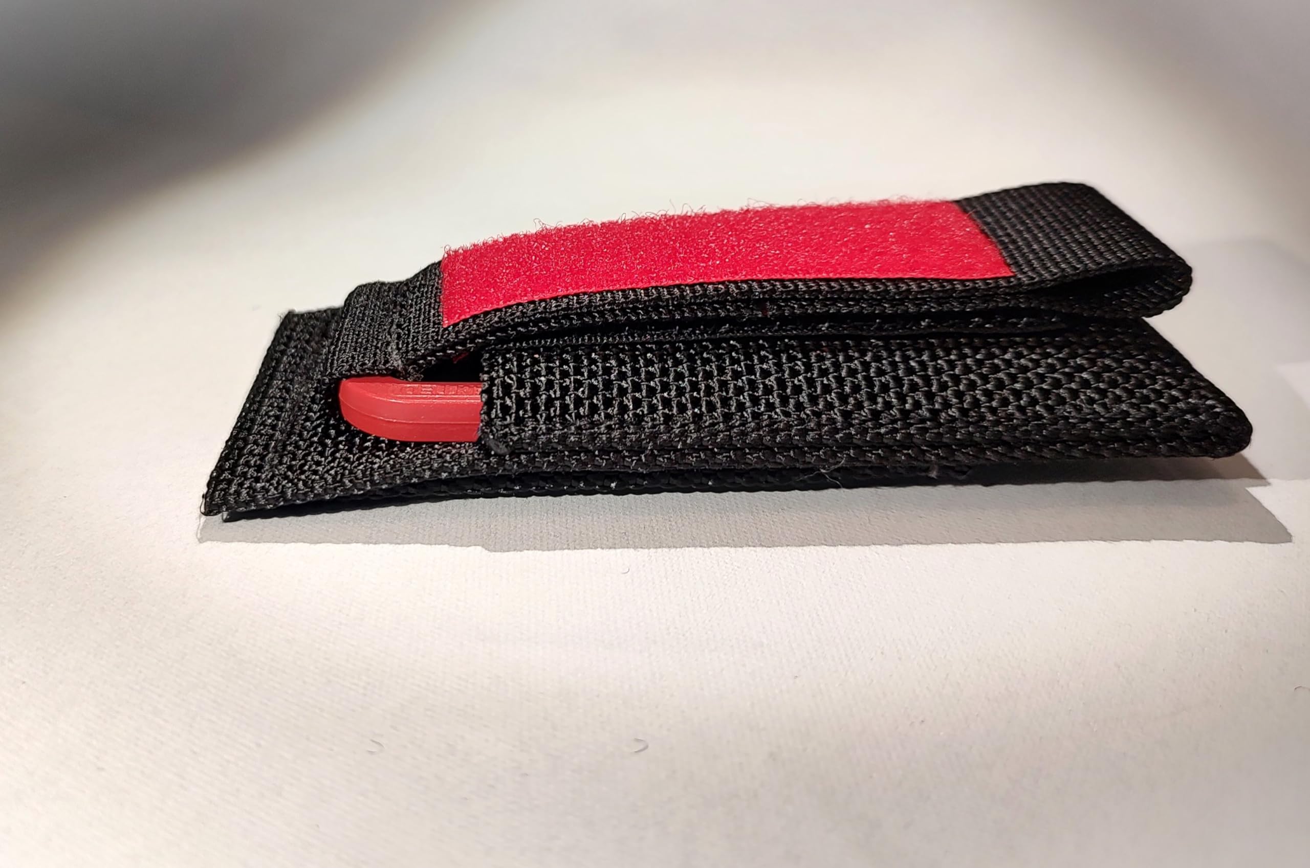 Authentic Red Trilobite Fossil with Black Handle & Red Loop - Premium Harness Pouch for Outdoor Adventures, Hiking Gear & Fossil Collecting