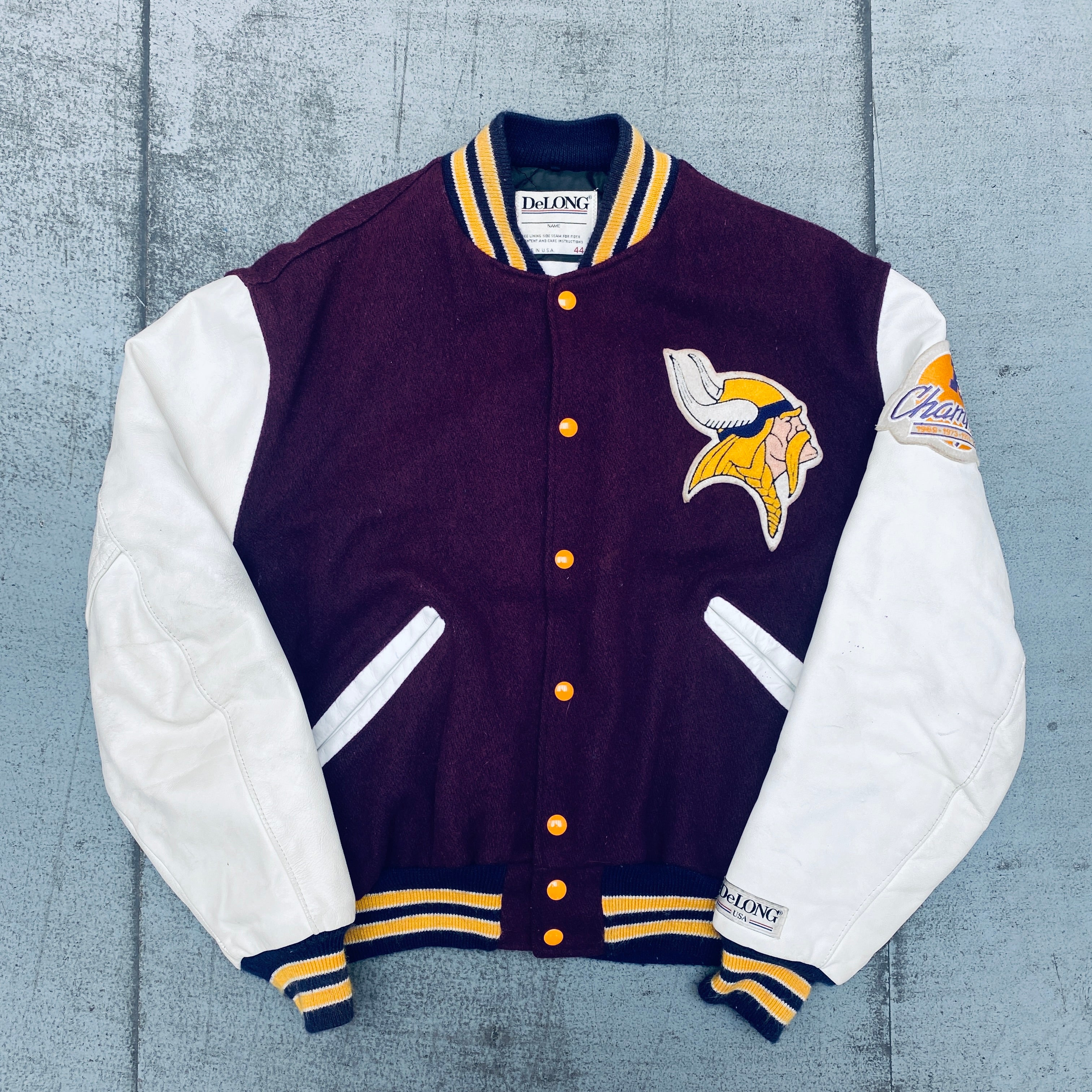 Minnesota Vikings 1980s DeLong Leather Sleeve Wool Varsity Jacket with NFC Champions Patch - Size Large | Retro NFL Football Fan Apparel for Game Day & Vintage Collectors